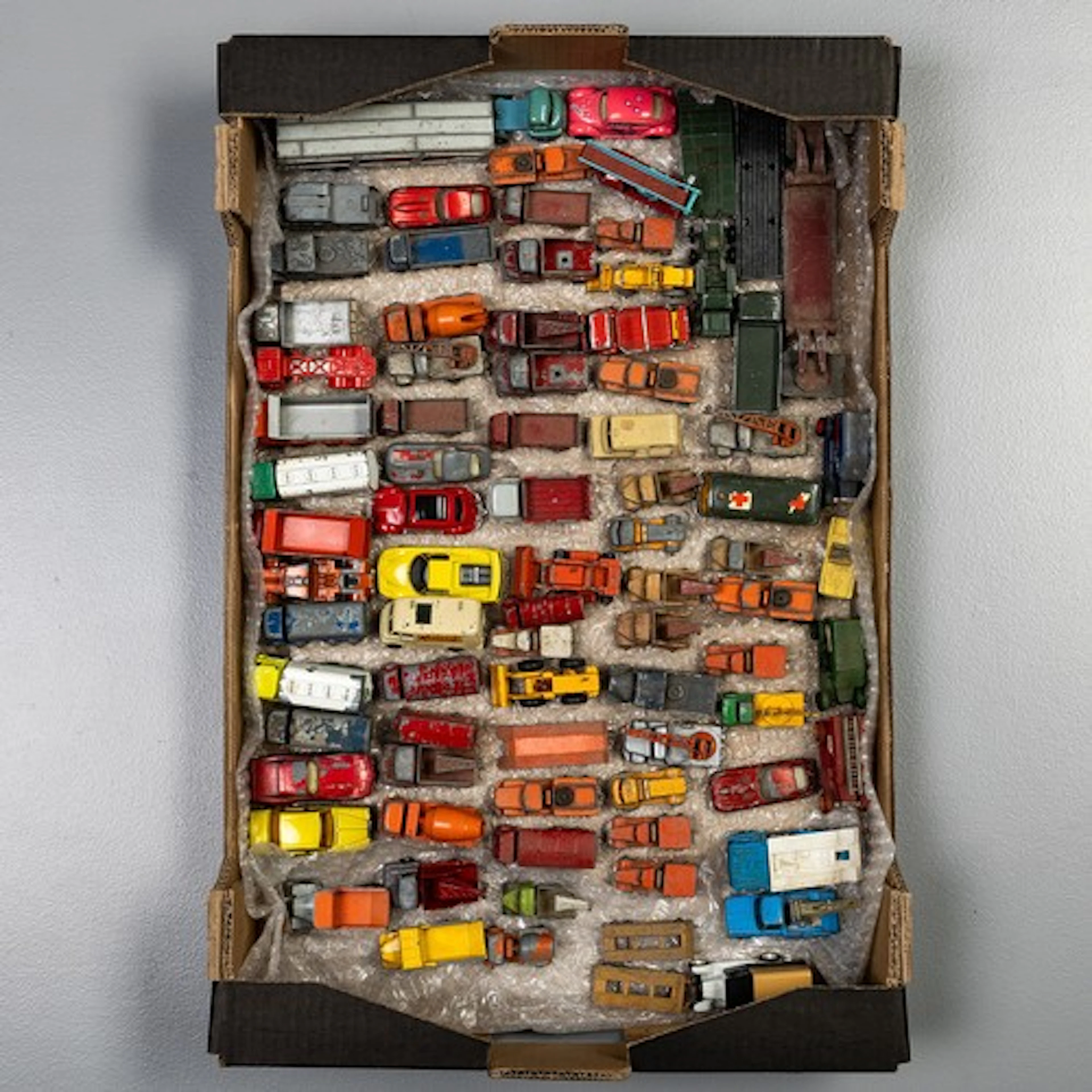 Fruit tray containing 70 original playworn matchbox vehicles...