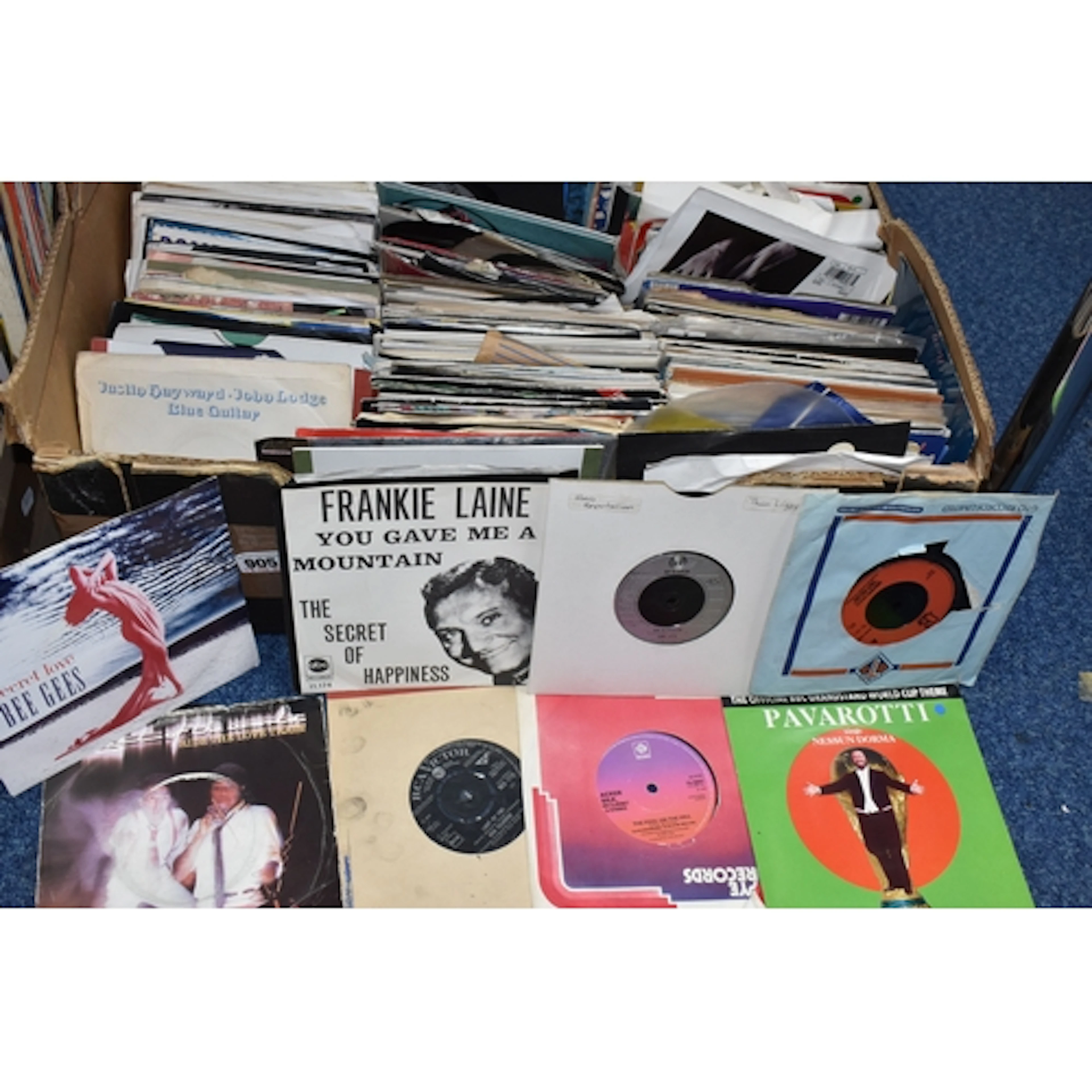 A BOX OF 45 RPM SINGLES to include approximately one hundred...