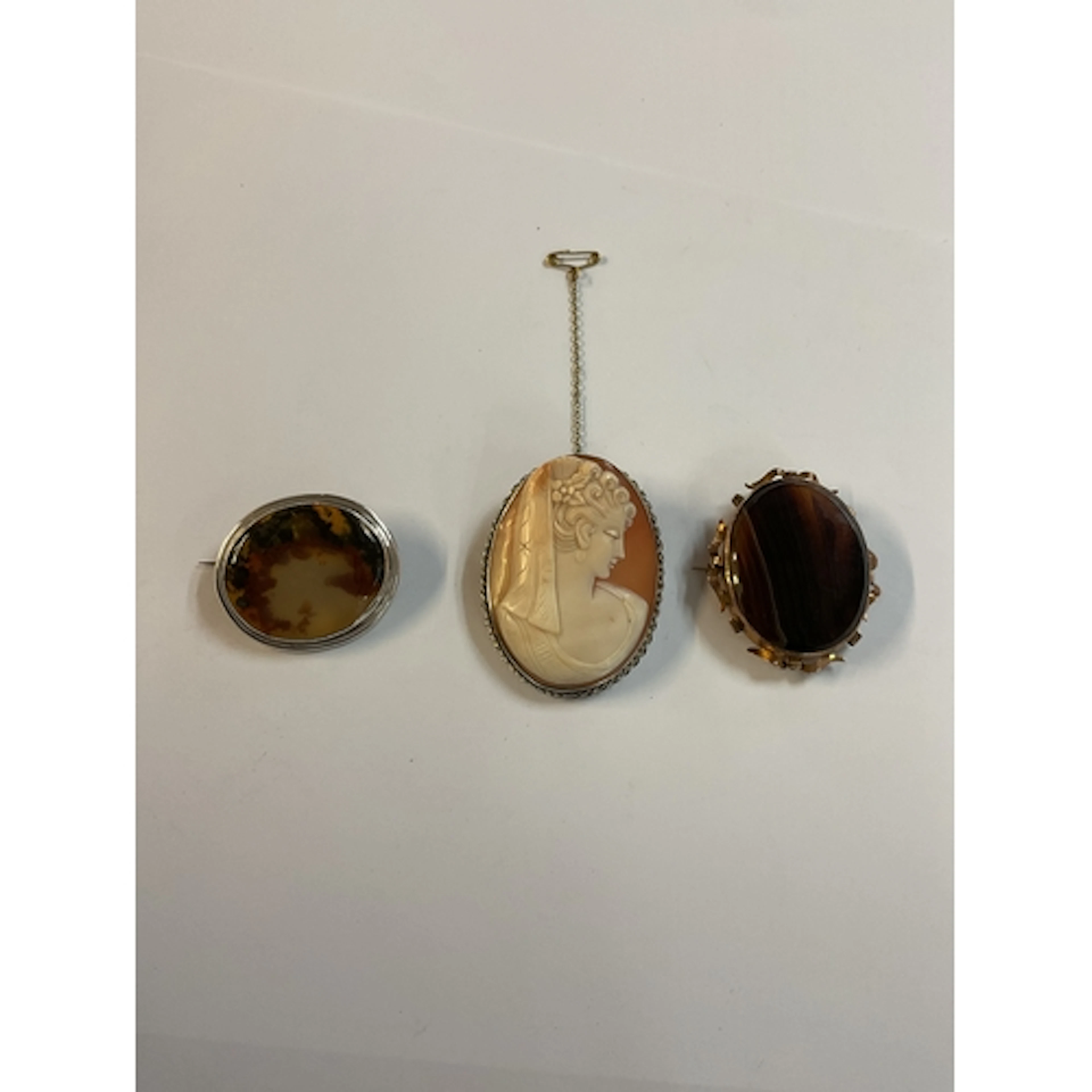 Three Brooches to inc a Cameo, a Smokey Quartz in a silver m...