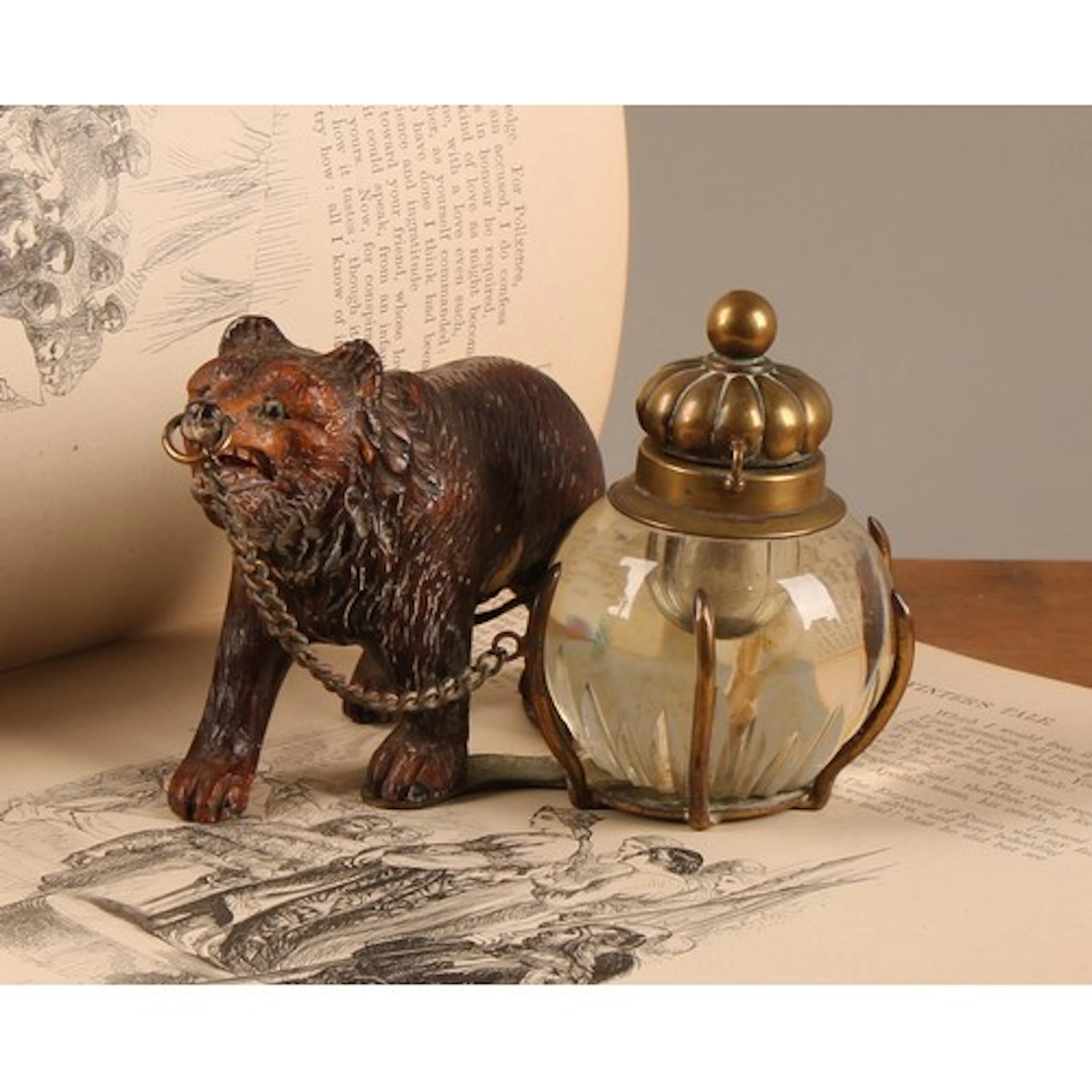 A Black Forest novelty inkwell, as a bear, on all fours, fla...