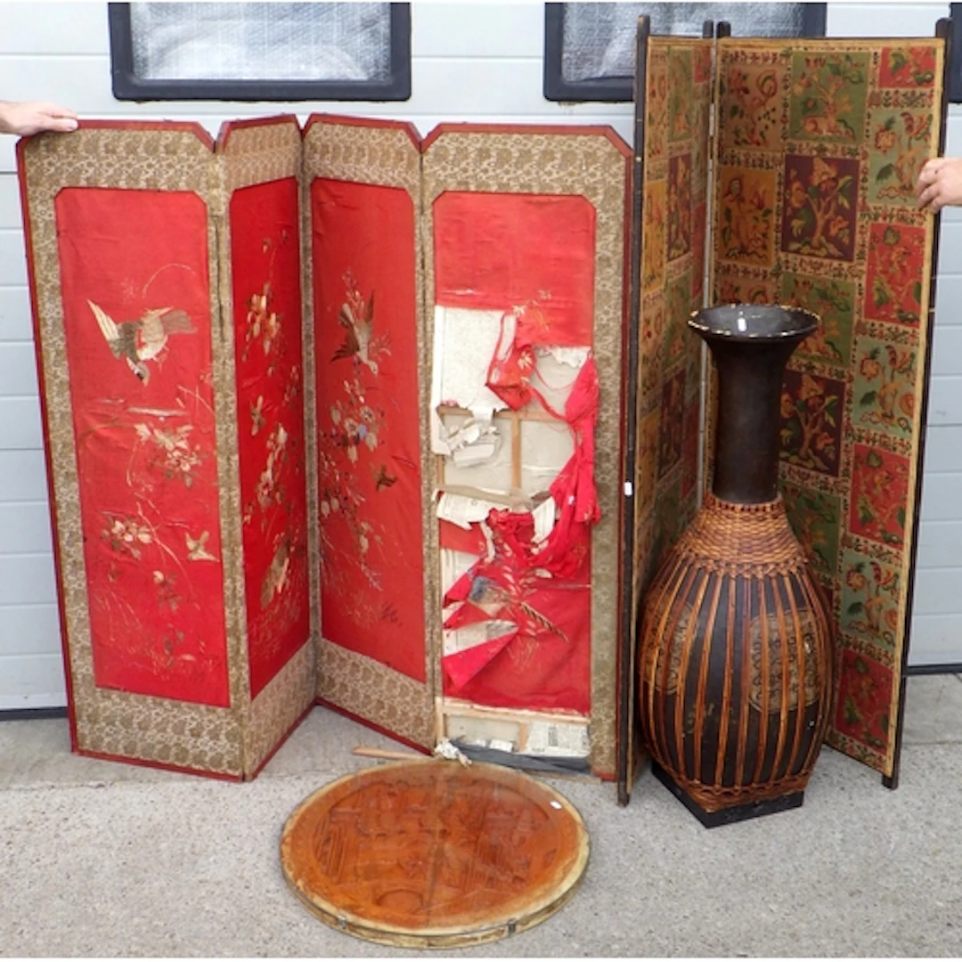 Two screens, circular table top and a tall papier mache vase...