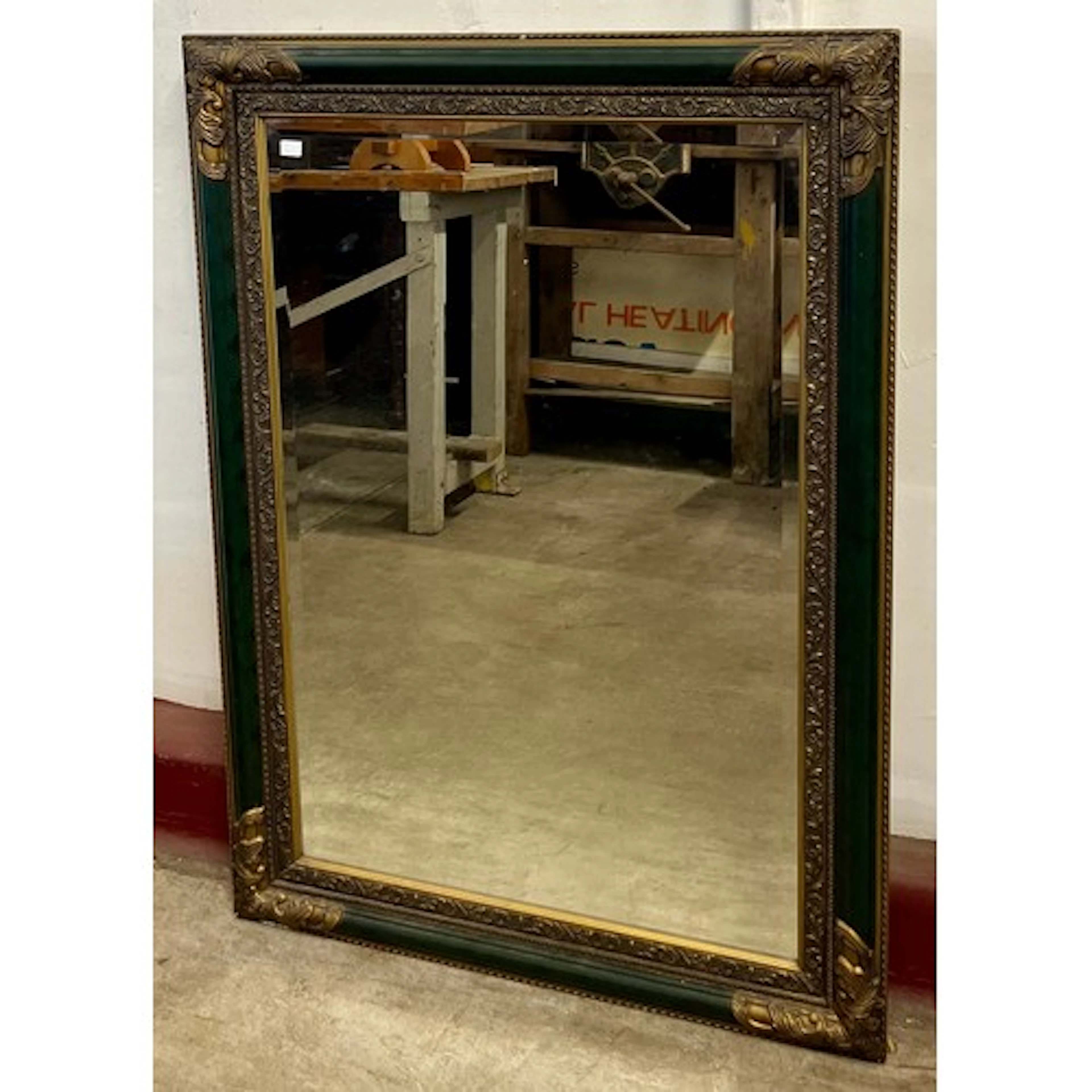 A Victorian style ebonised and parcel gilt framed mirror