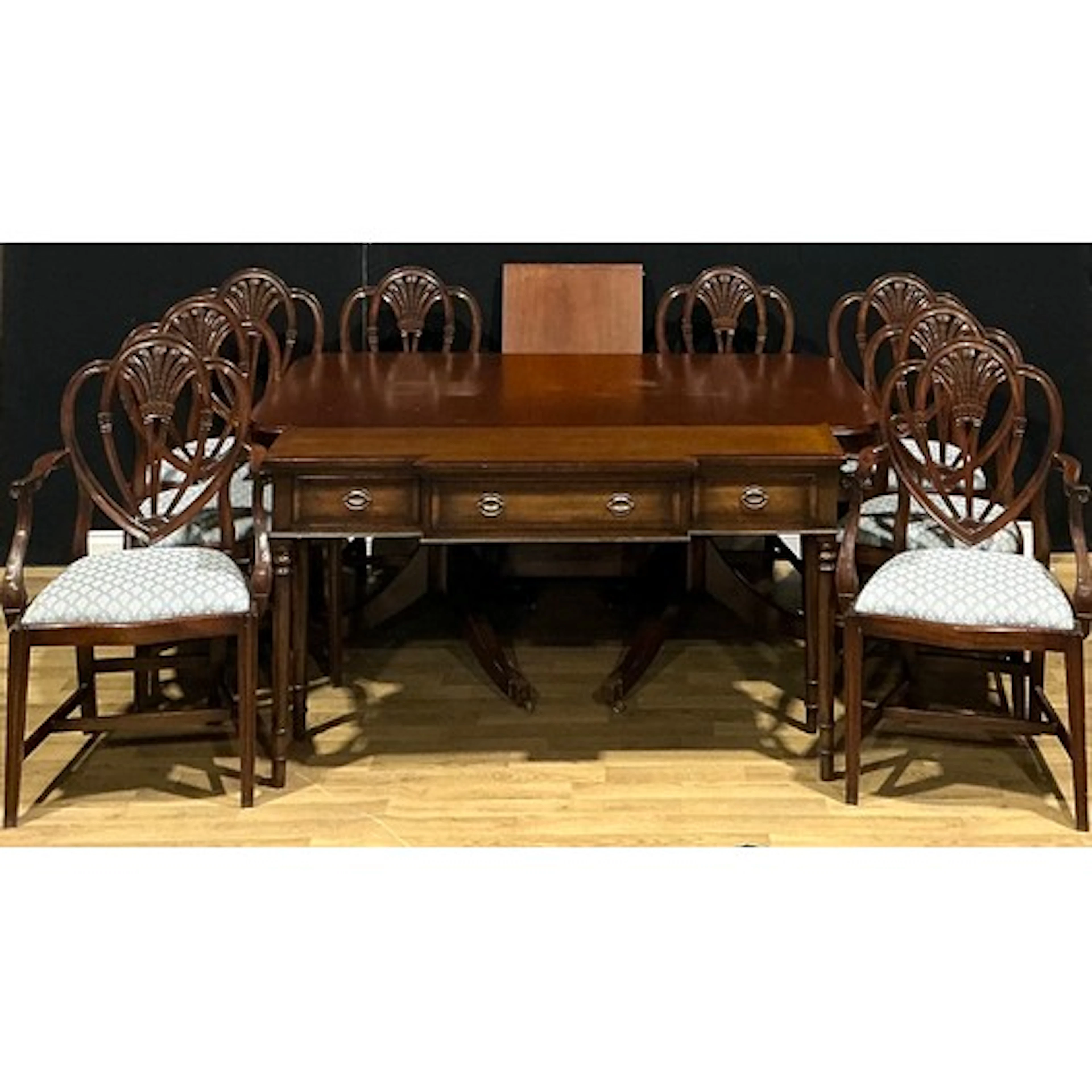 A contemporary Regency style extending dining table, one add...
