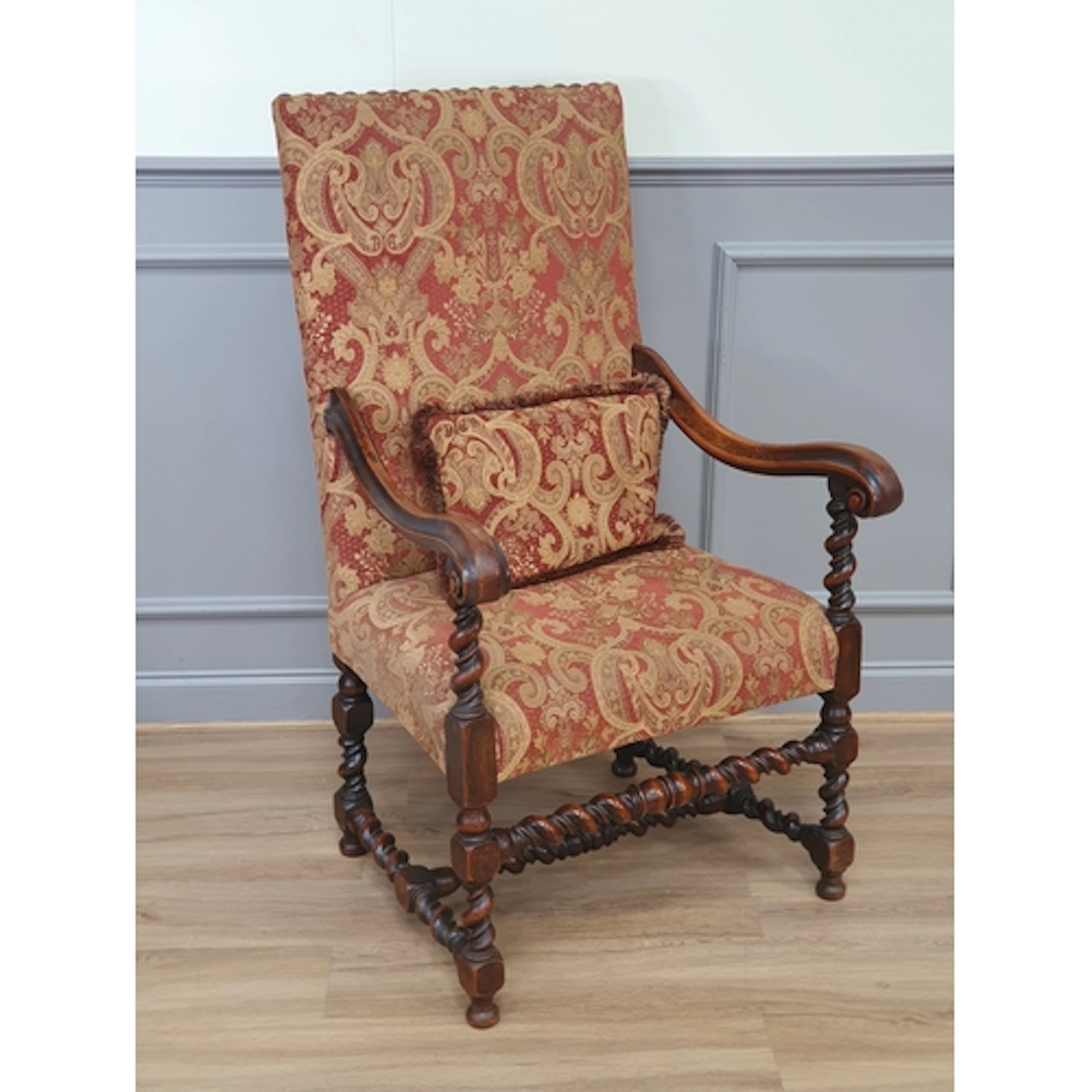 A Carolean style walnut Elbow Chair with upholstered back an...