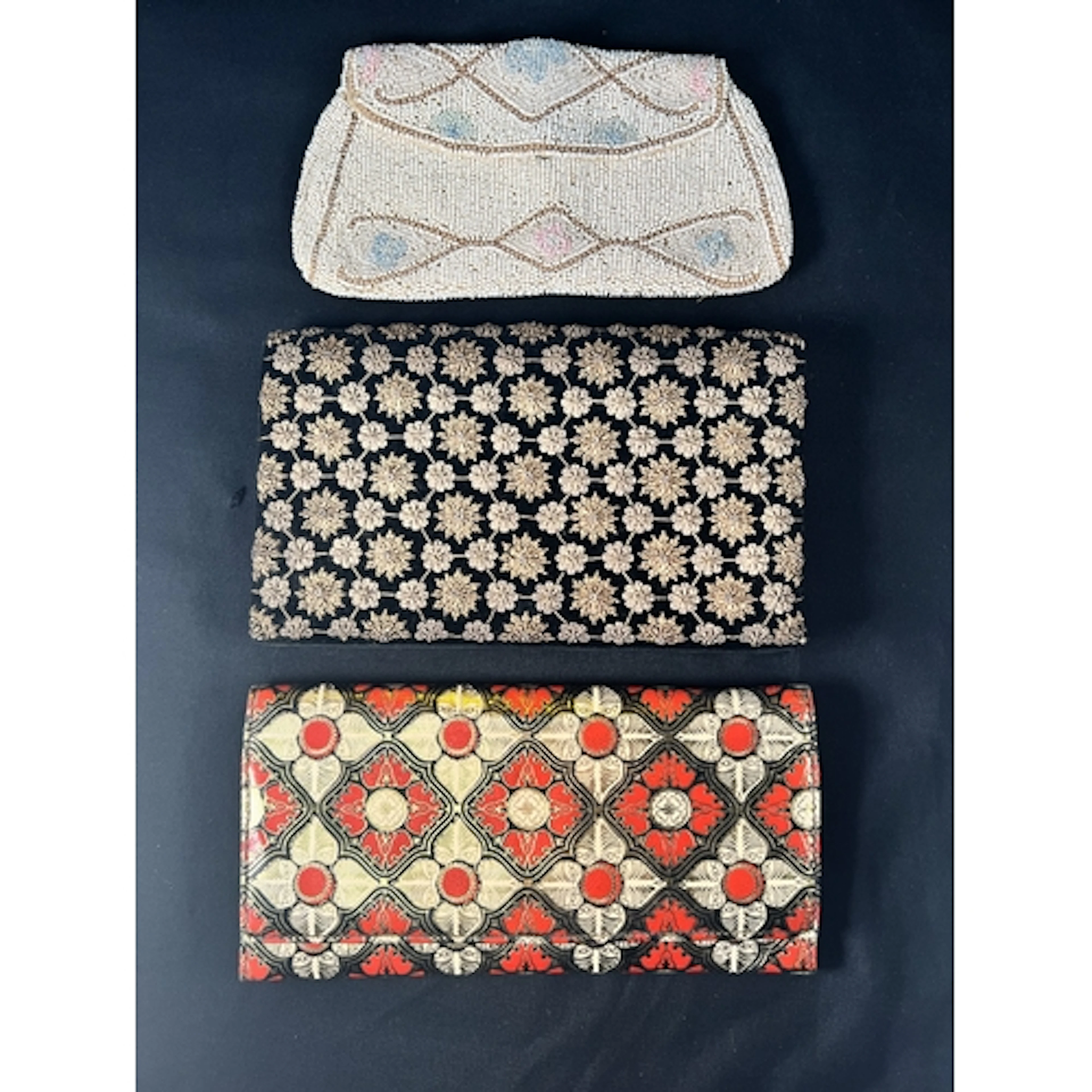 An Art Deco micro beaded clutch bag with label Handmade in B...