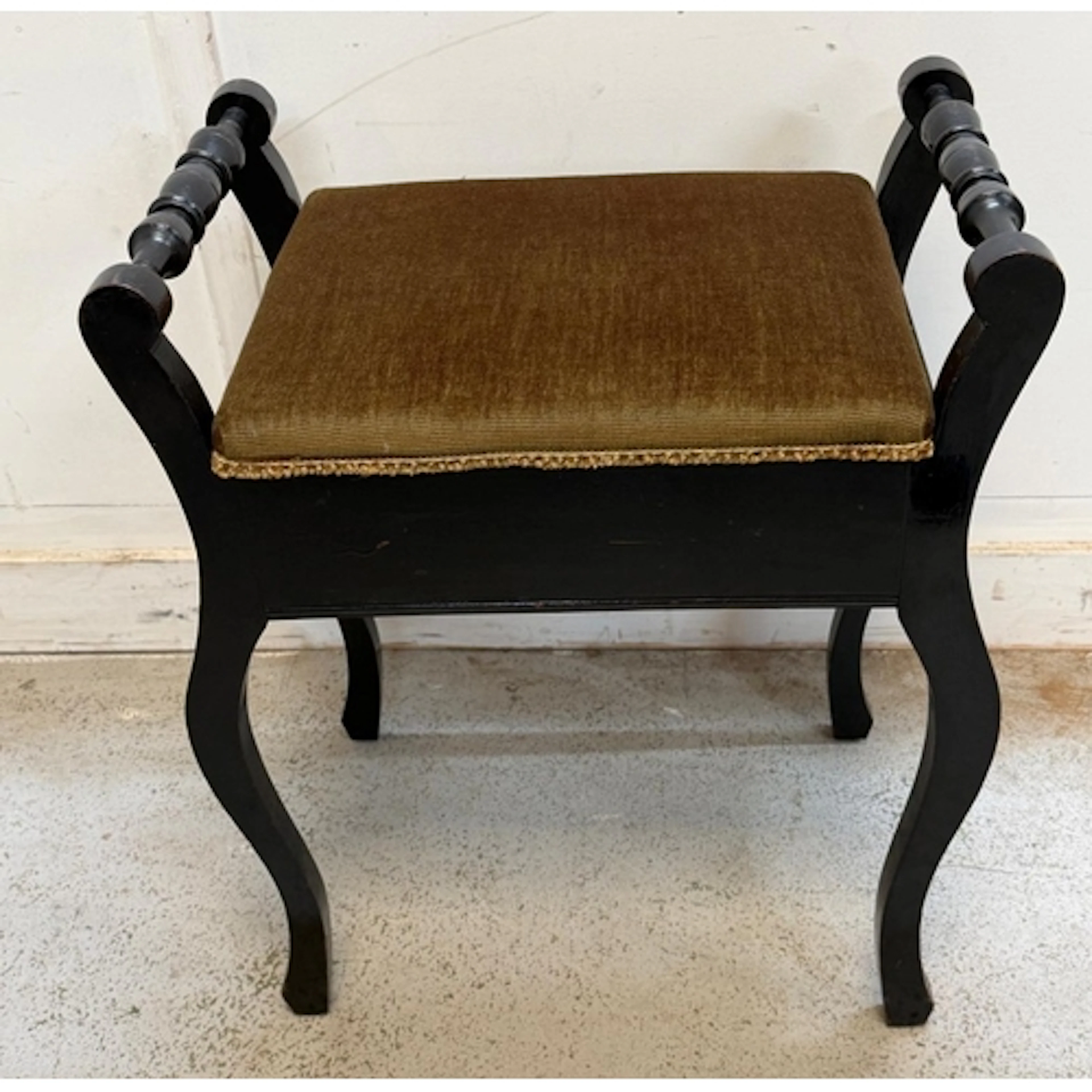 A music stool with the sheet opening to music sheets