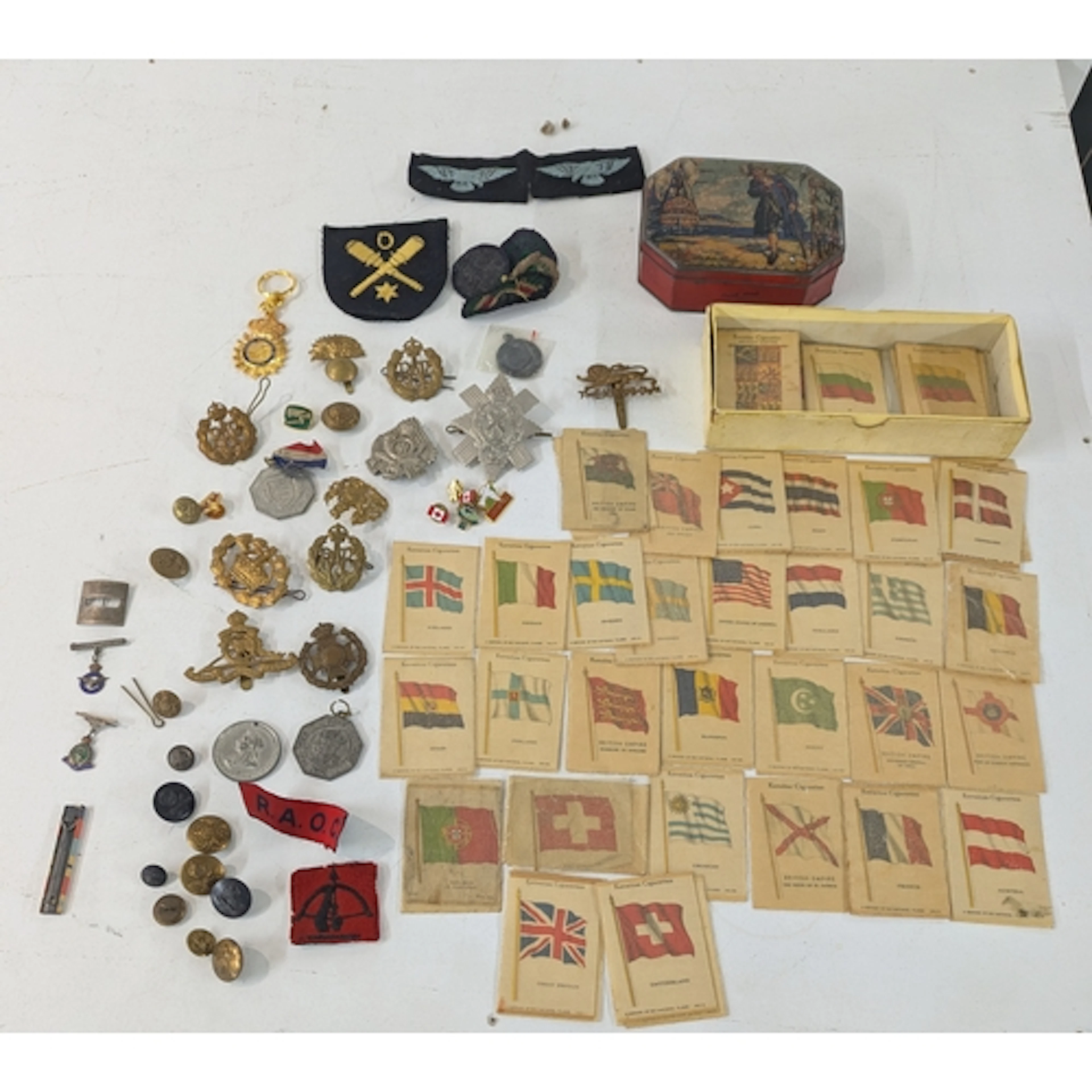 A collection of military memorabilia, including regimental c...