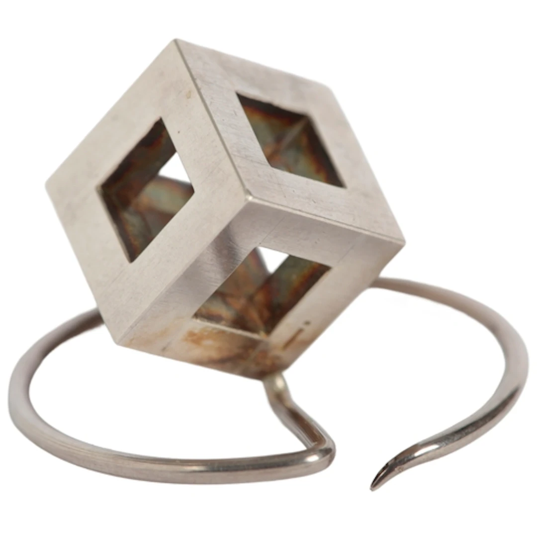 § Frank Bauer, a silver brooch, designed as a cube with open...
