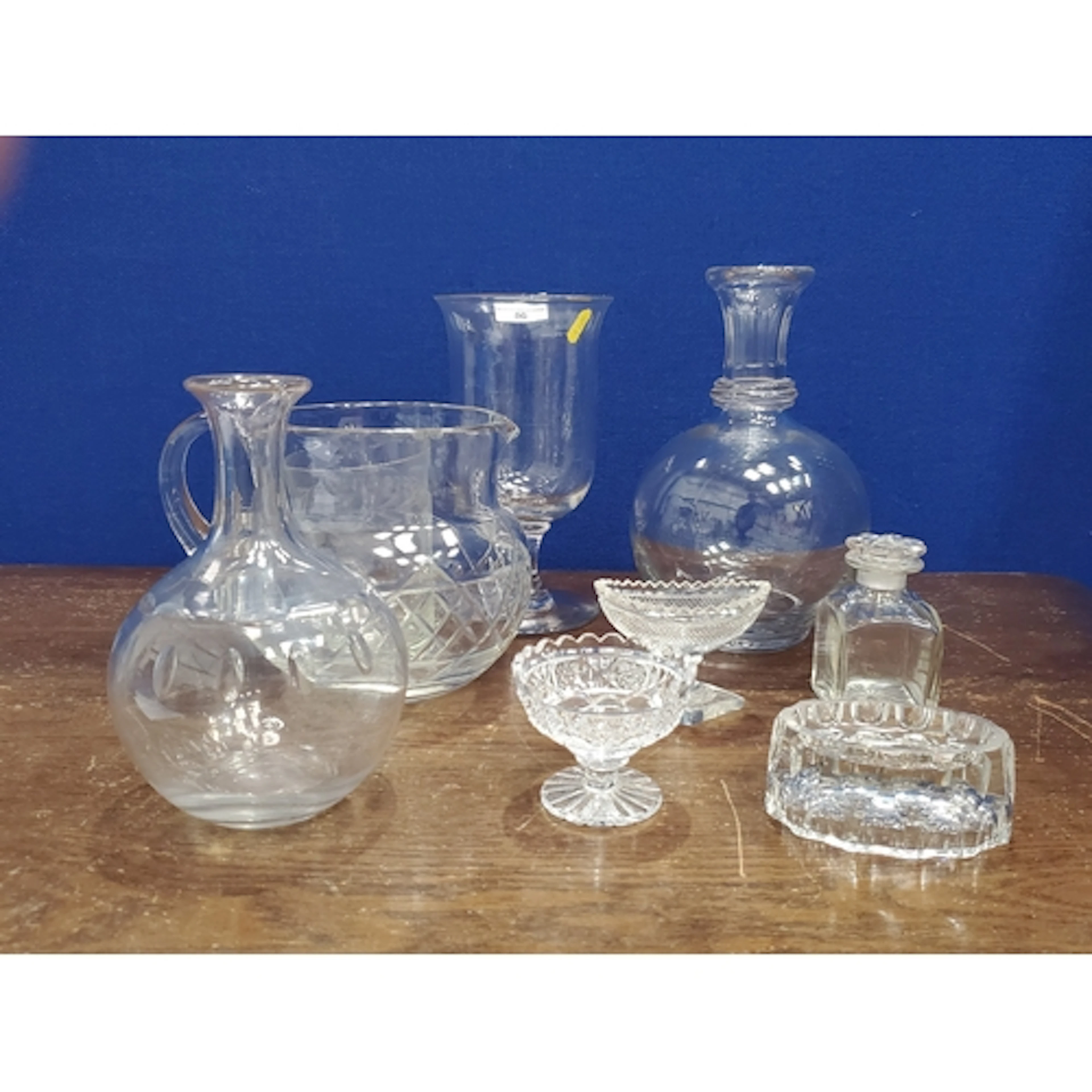 A baluster glass Celery Vase, two Carafes, a Tumbler, square...