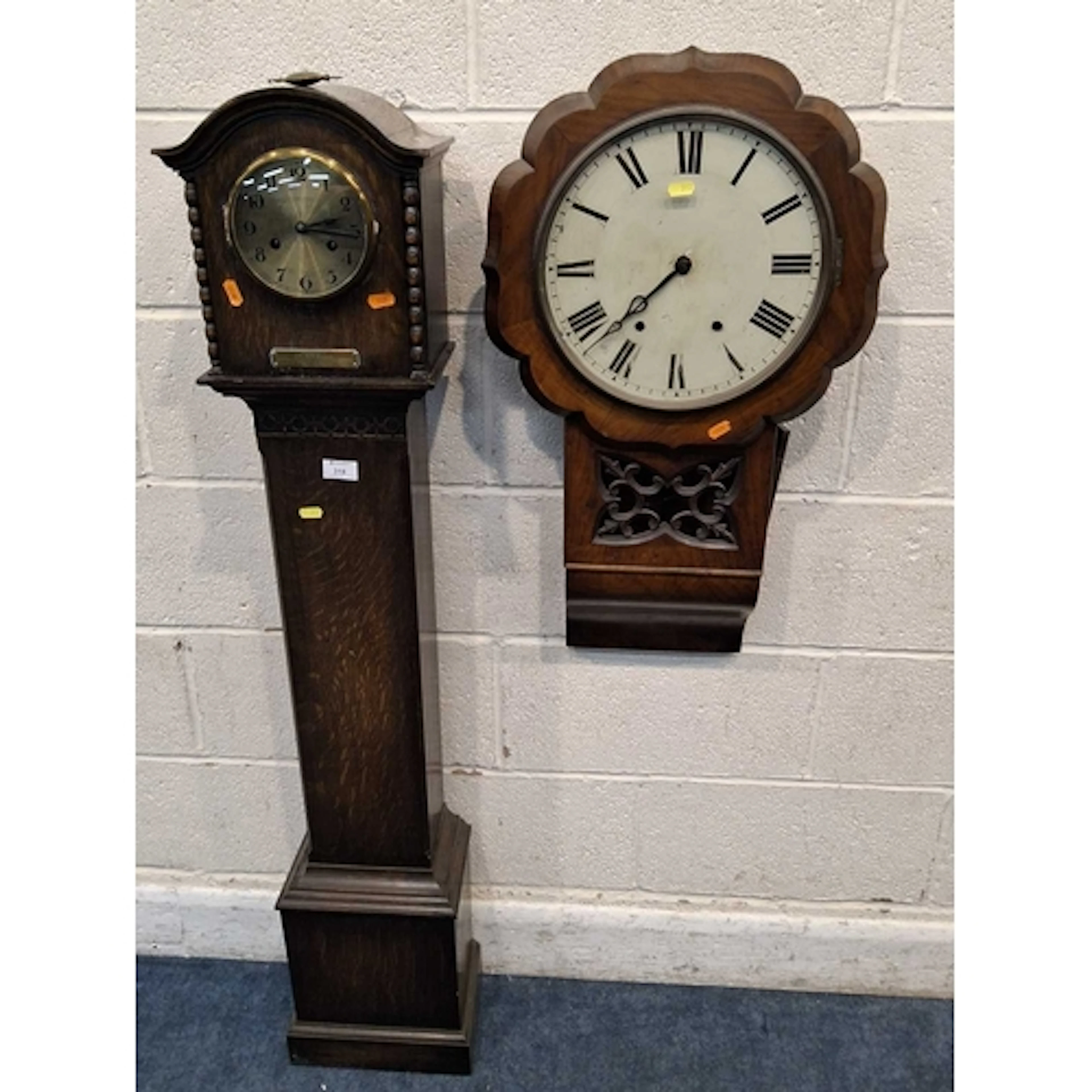 A 20TH CENTURY OAK GRANDDAUGHTER CLOCK, along with a wall cl...