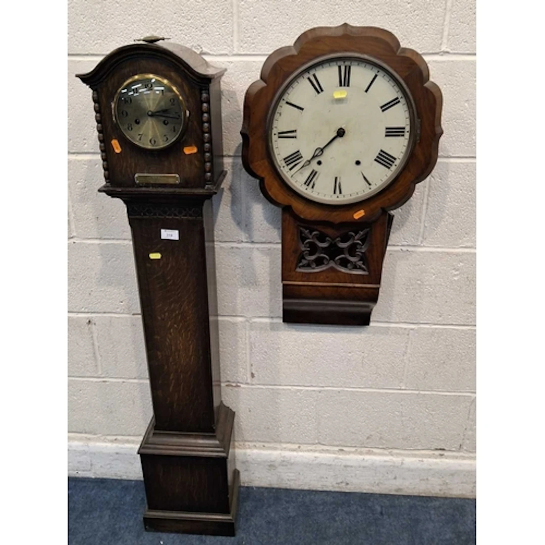 A 20TH CENTURY OAK GRANDDAUGHTER CLOCK, along with a wall cl...