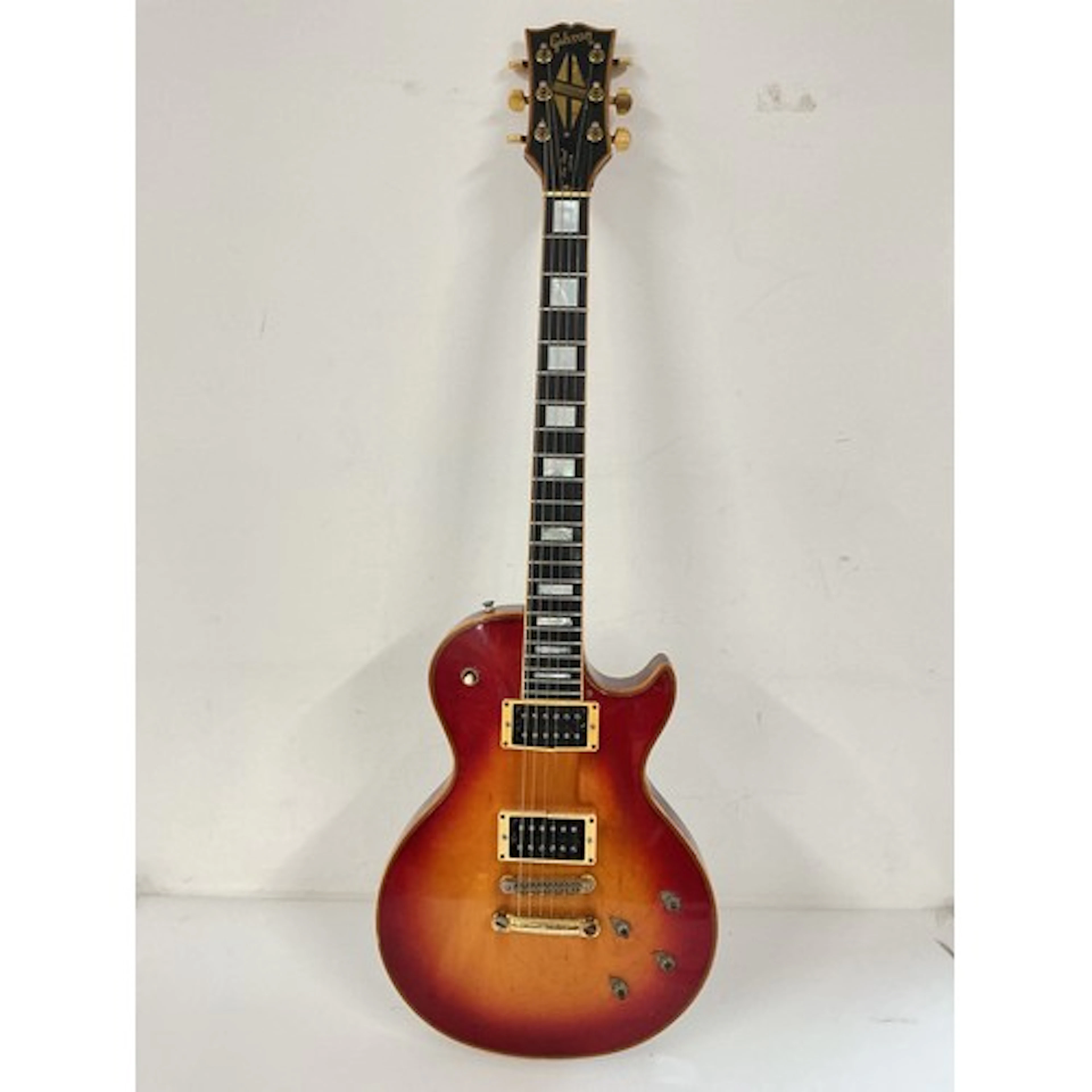 A circa 1970s Gibson Les Paul Custom electric guitar in a su...