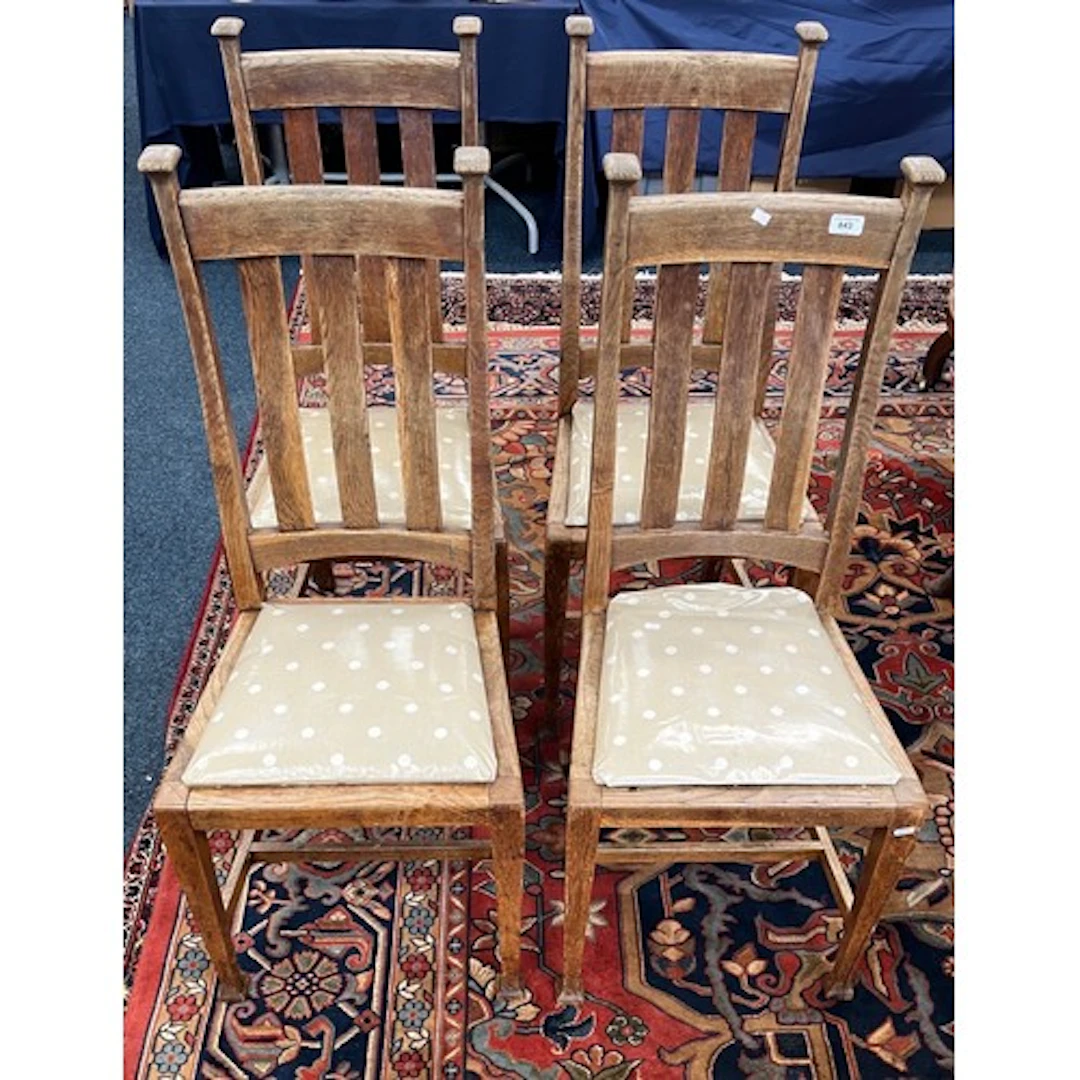 Set of four vertical slat back dining chairs.