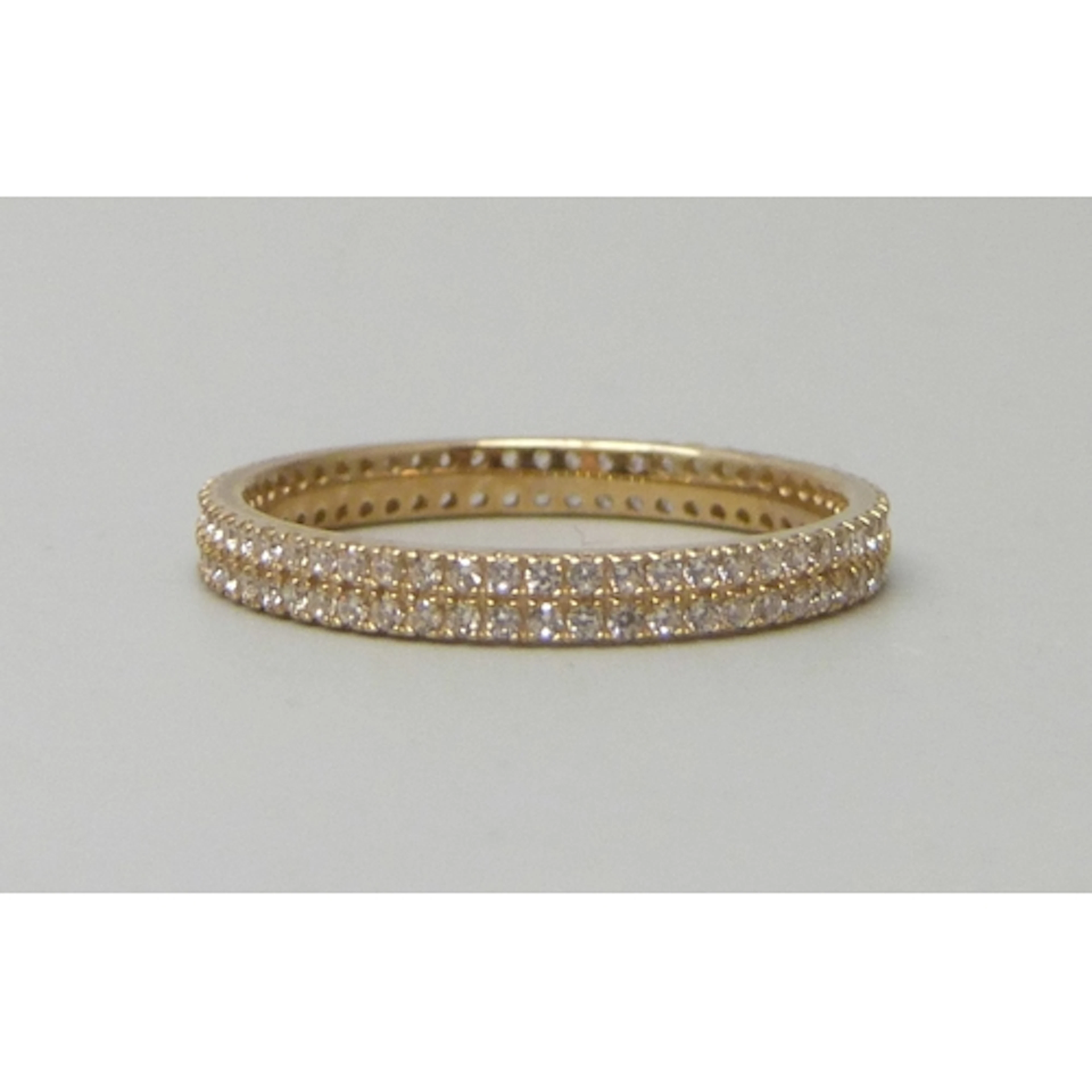 A 9ct gold and cubic zirconia eternity ring, 1.5g, P