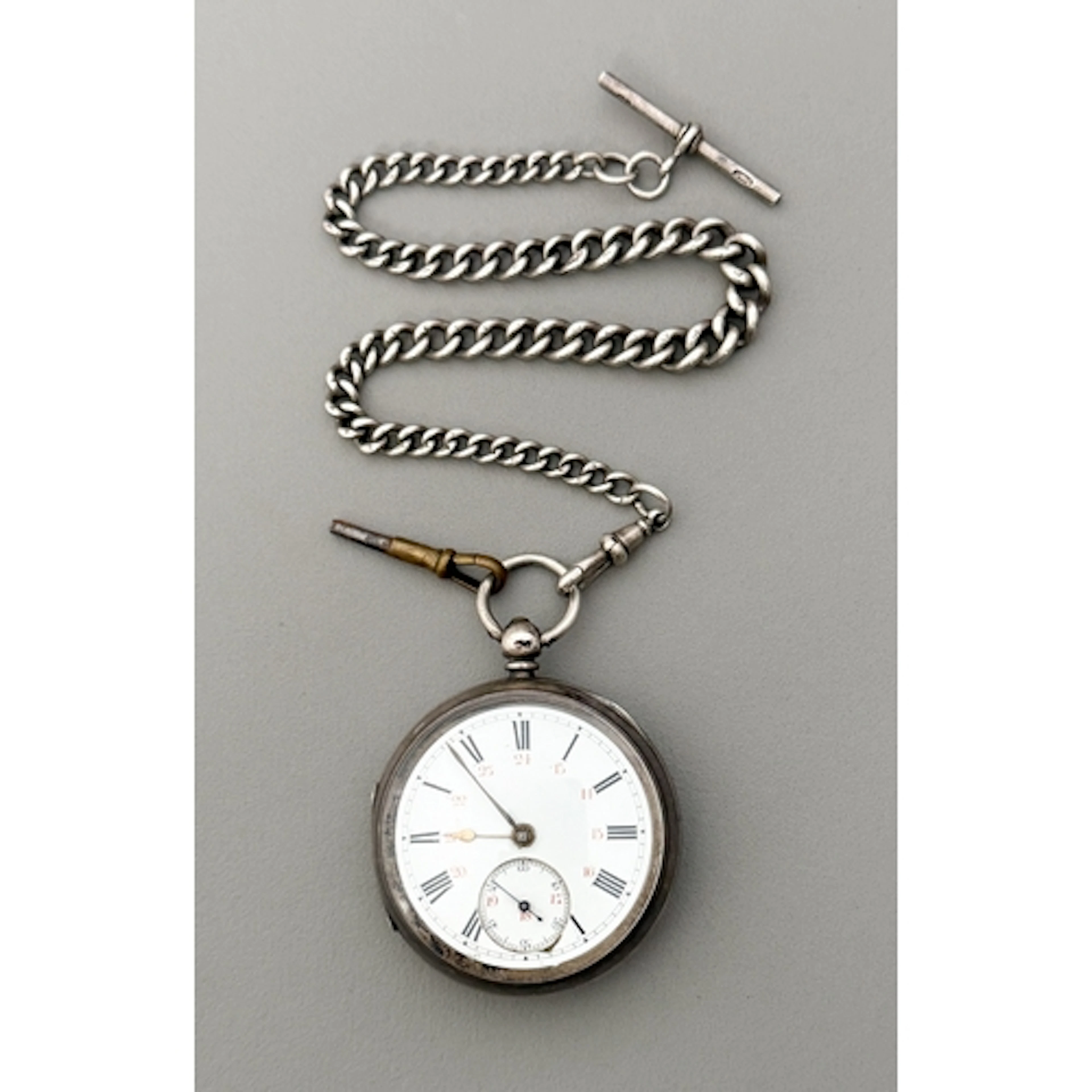 A Victorian silver pocket watch on a fob chain - by William ...