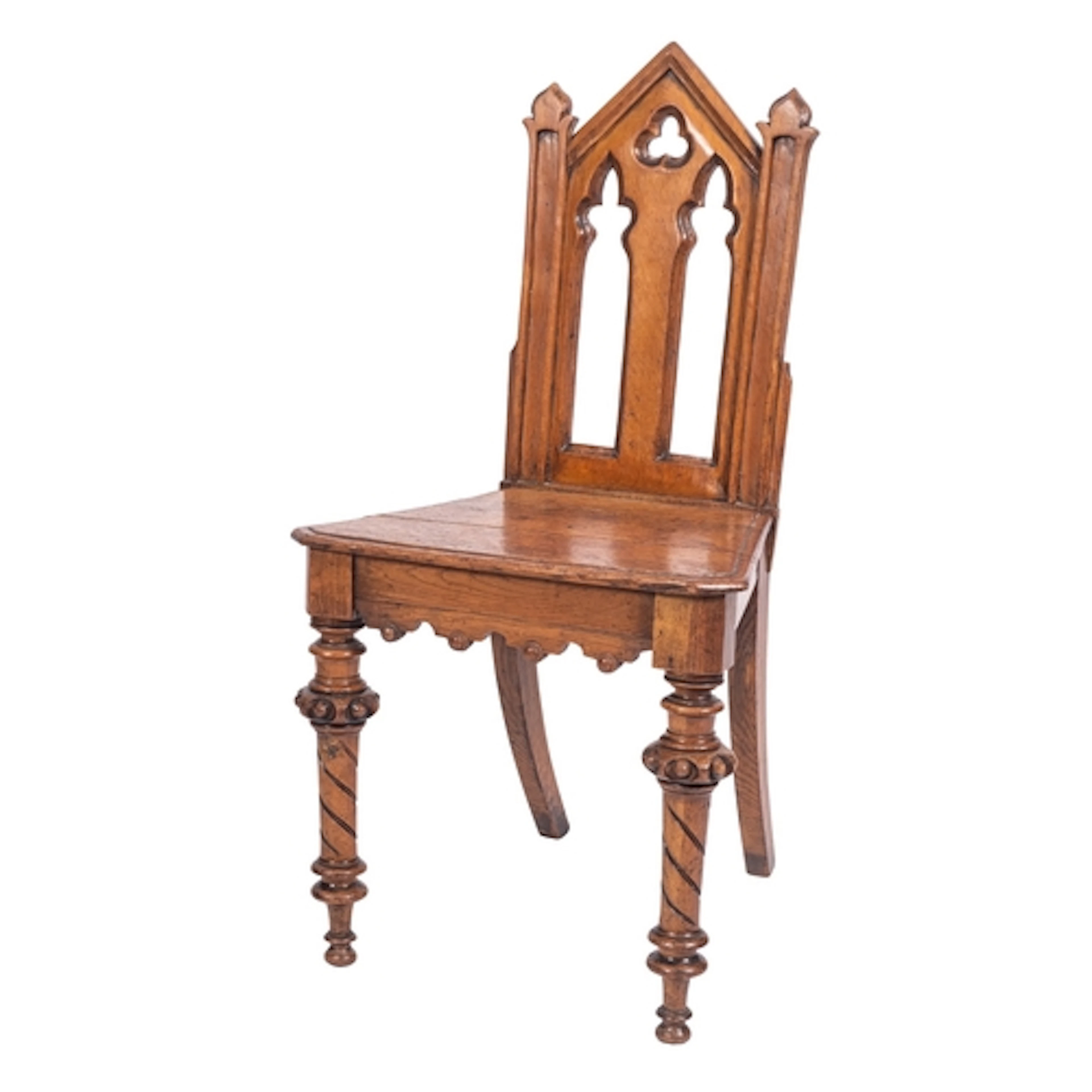 A Victorian oak hall chair in Gothic style, circa 1880; the ...