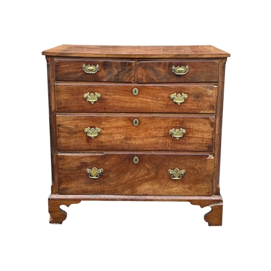 A GEORGE III MAHOGANY CHEST OF DRAWERS Two short over three ...