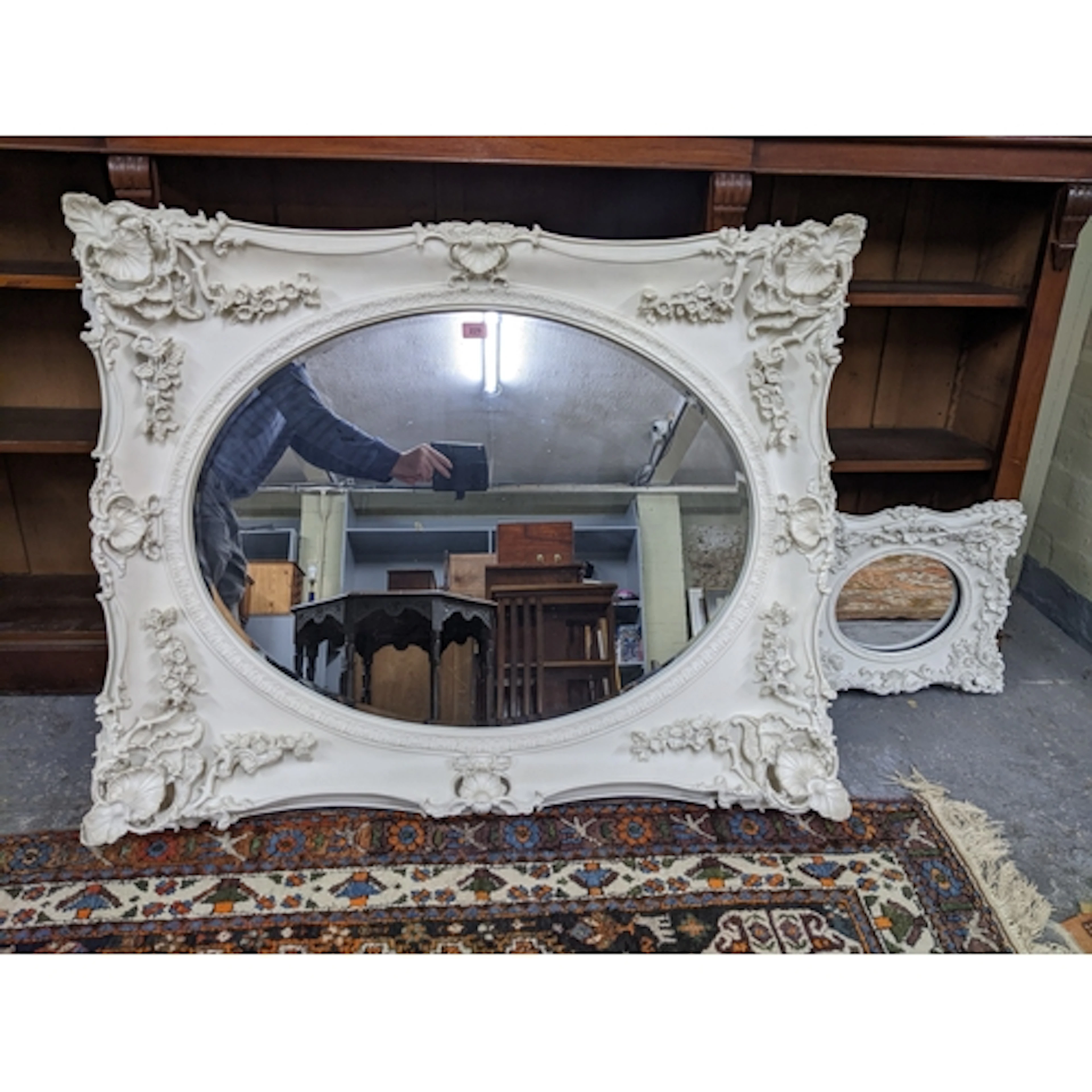 A contemporary ornate relief cast composition framed wall mi...