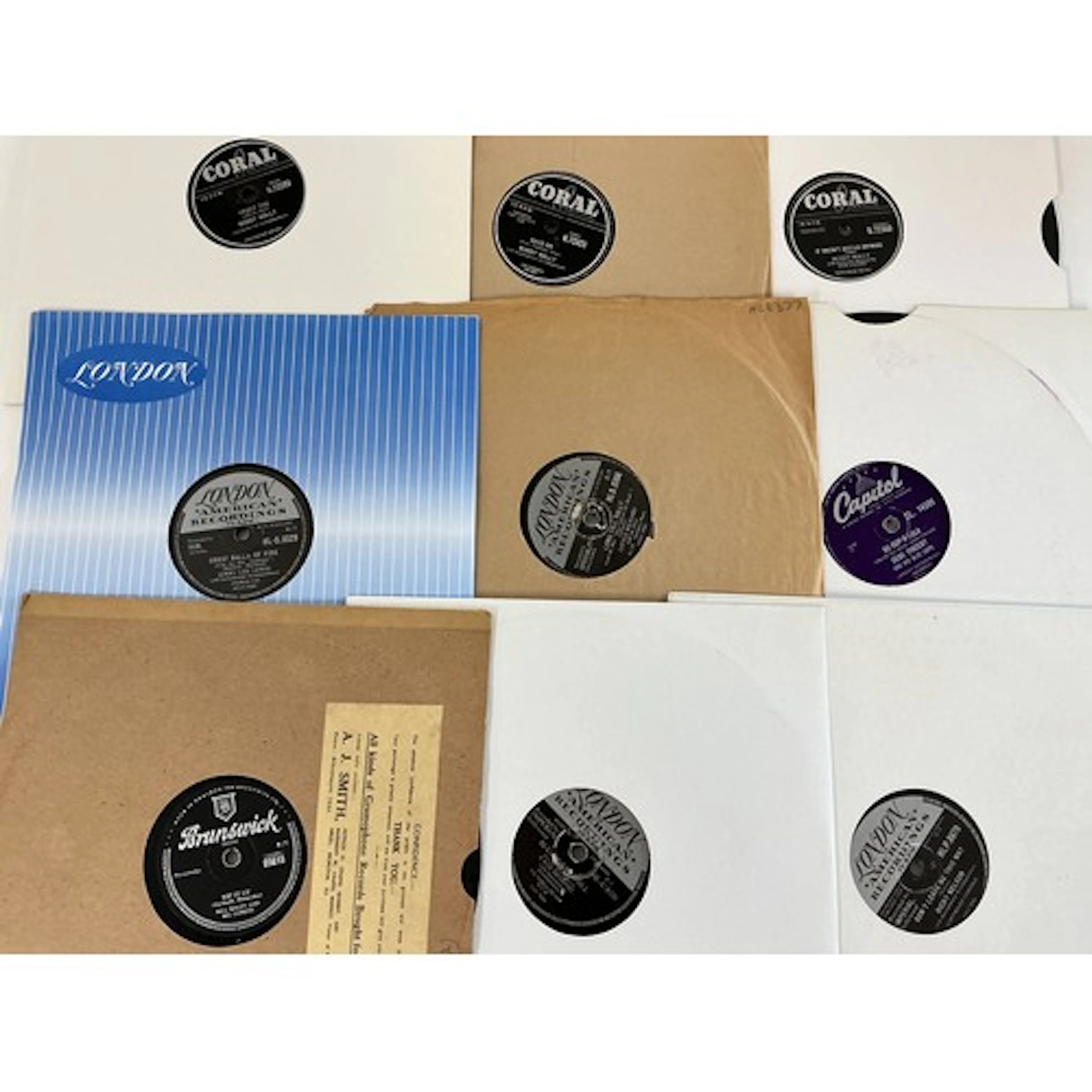 A collection of 78s by rock n roll artists including Gene Vi...