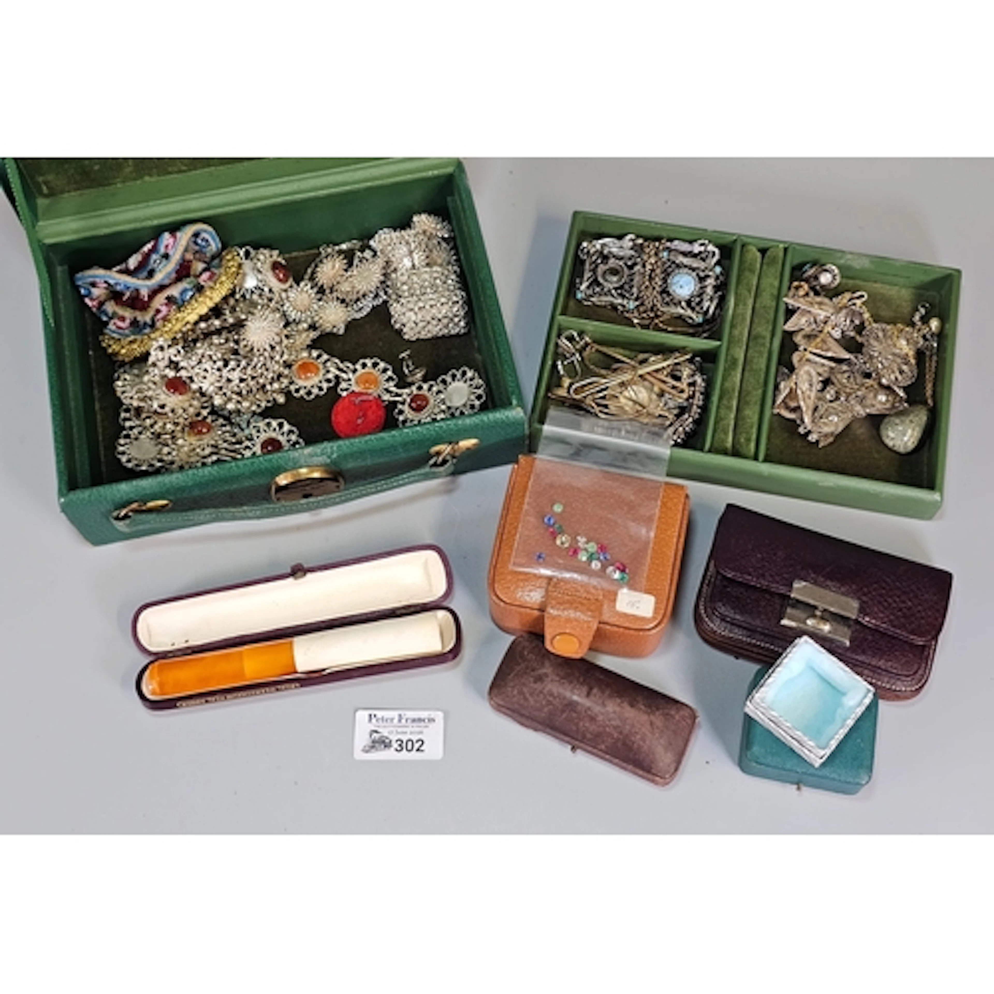Leather jewellery box comprising assorted white metal and co...