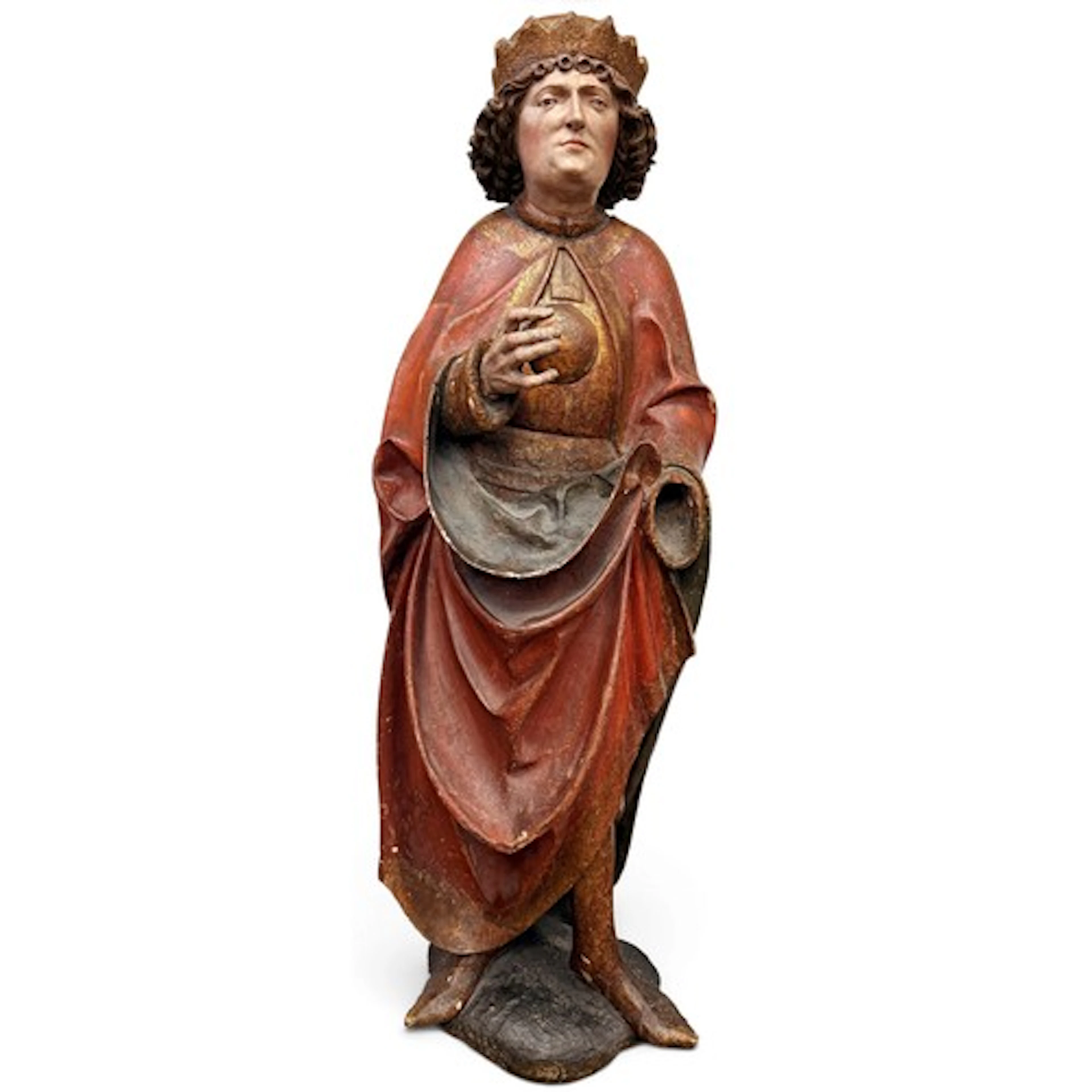 A fine gilt and polychromed limewood figure of a saintly kin...