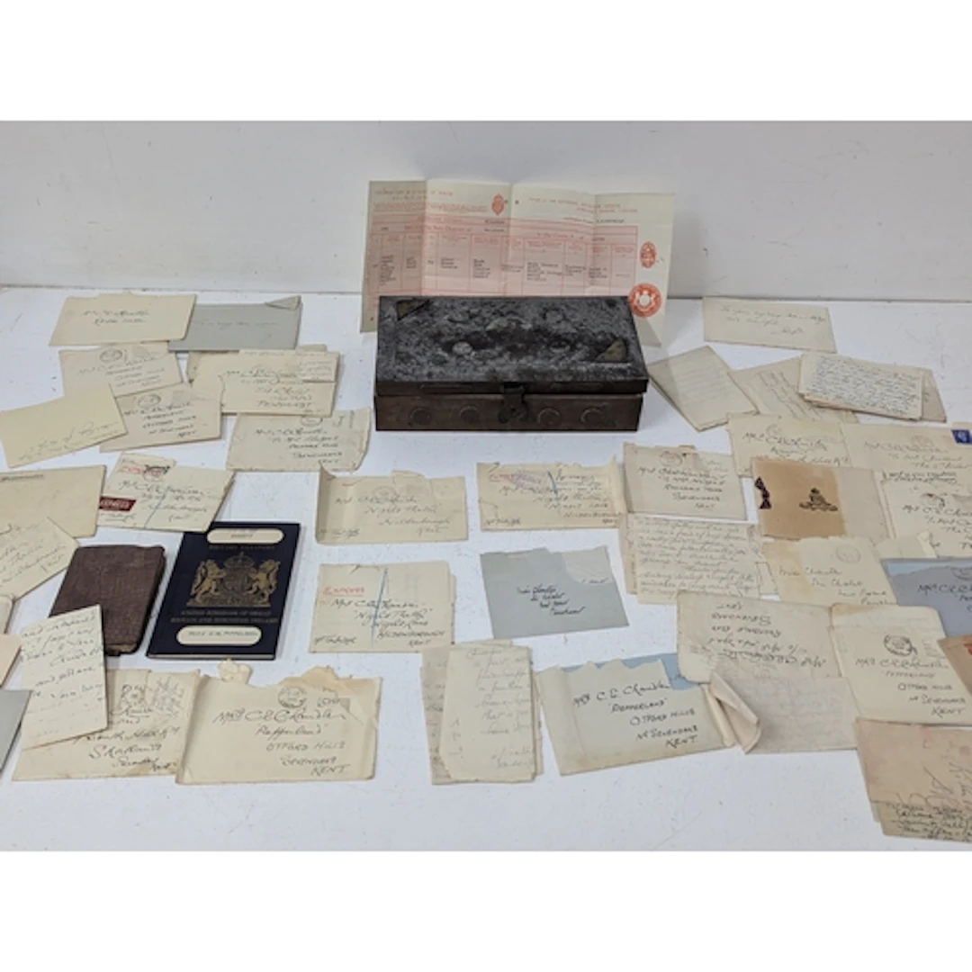A collection of WWII letters and an Entry of Birth, housed w...