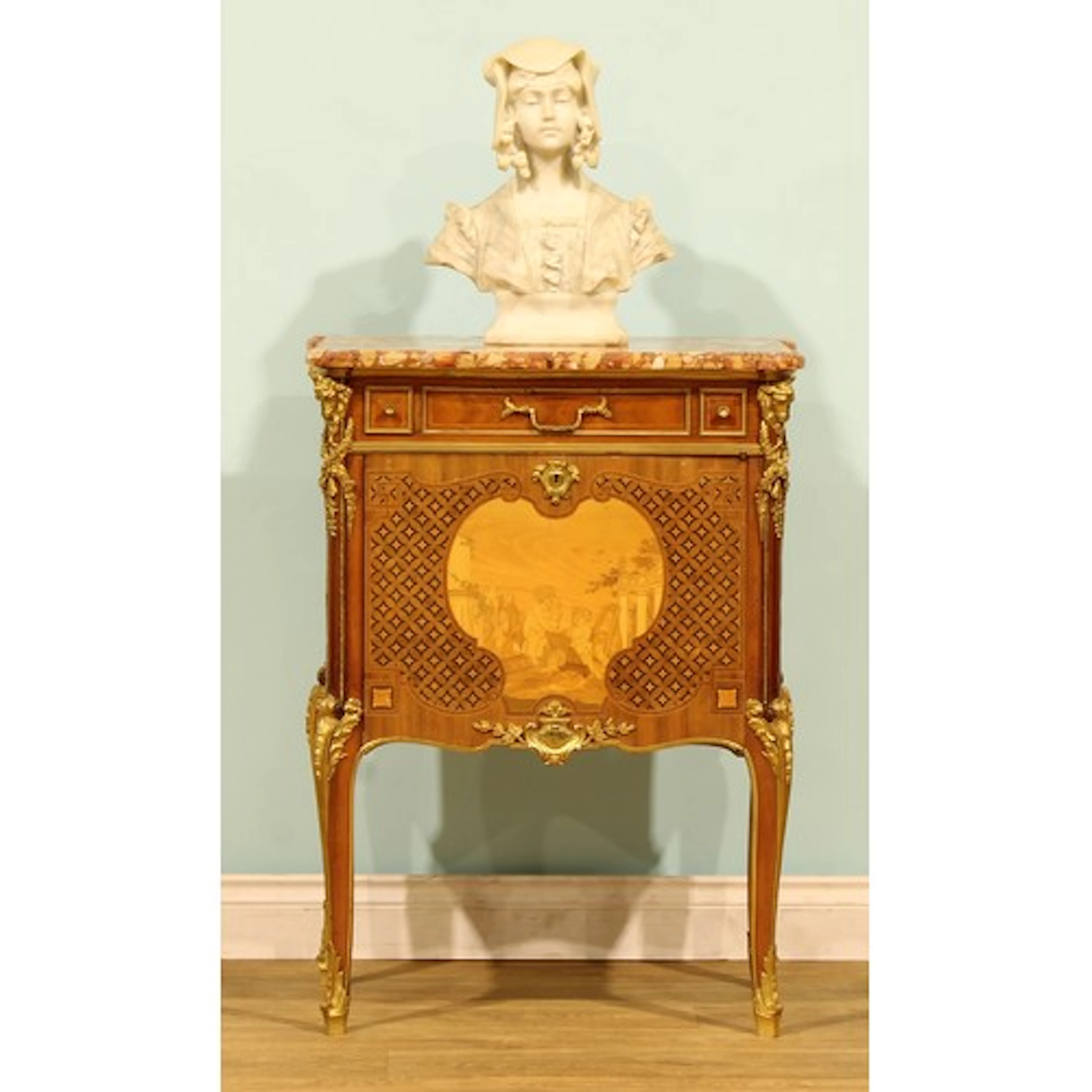 A French ormolu mounted marquetry and parquetry side cabinet...