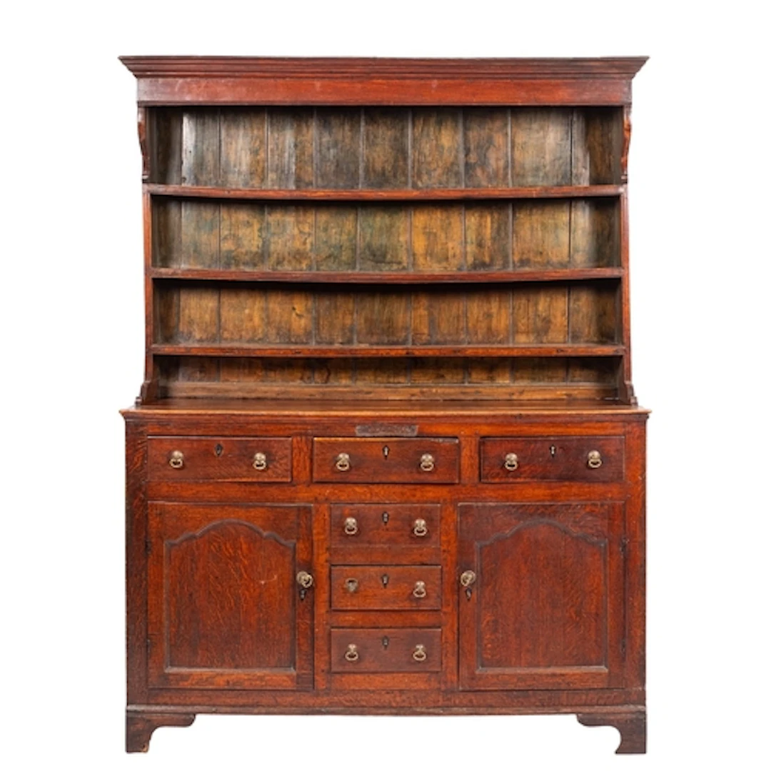 A George III oak dresser, circa 1770; the upper part with mo...