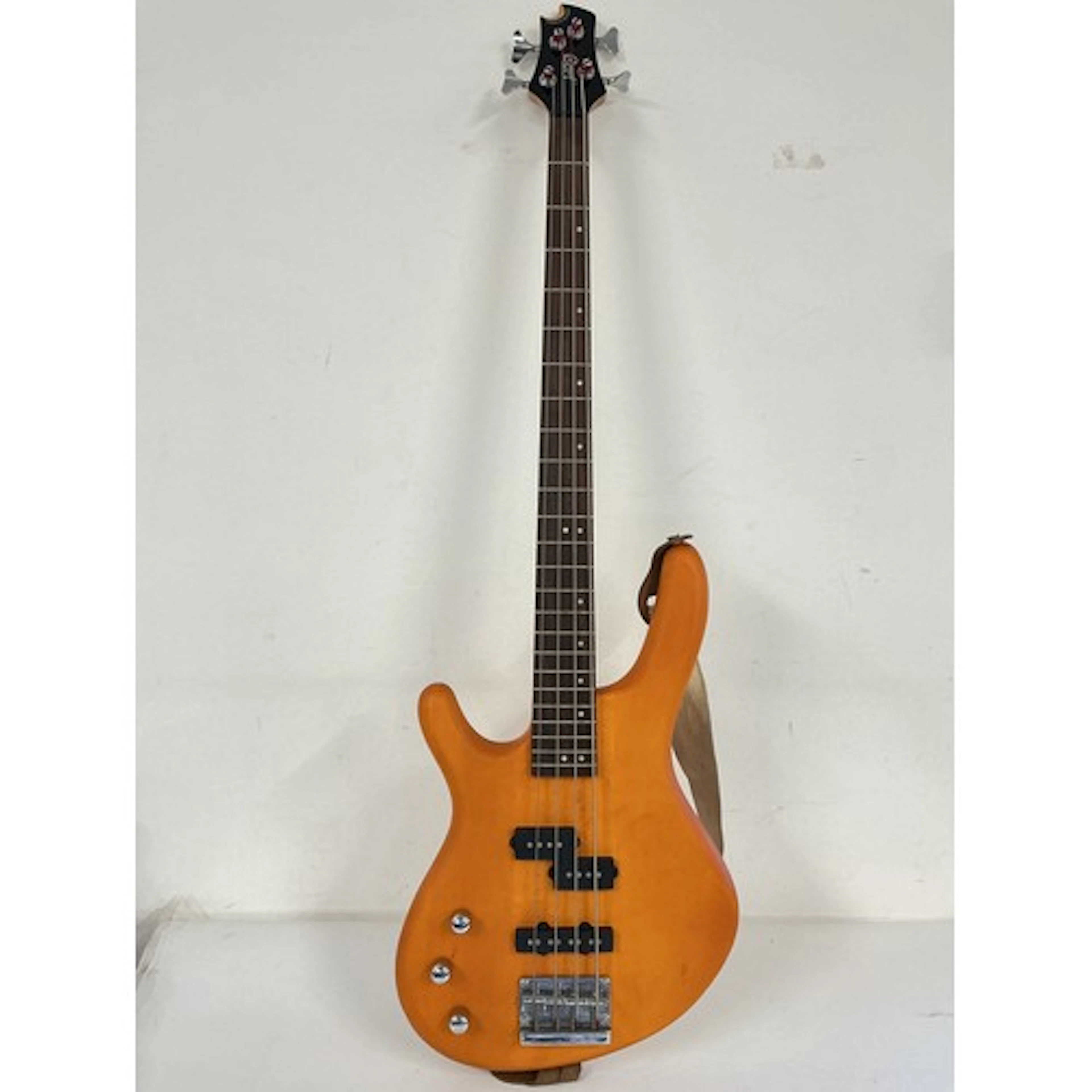 A left handed Cort Action bass guitar, no case.