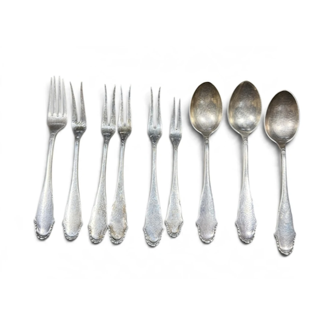 THREE DANISH SILVER SPOT-HAMMERED SPOONS AND SIX FORKS Bead ...