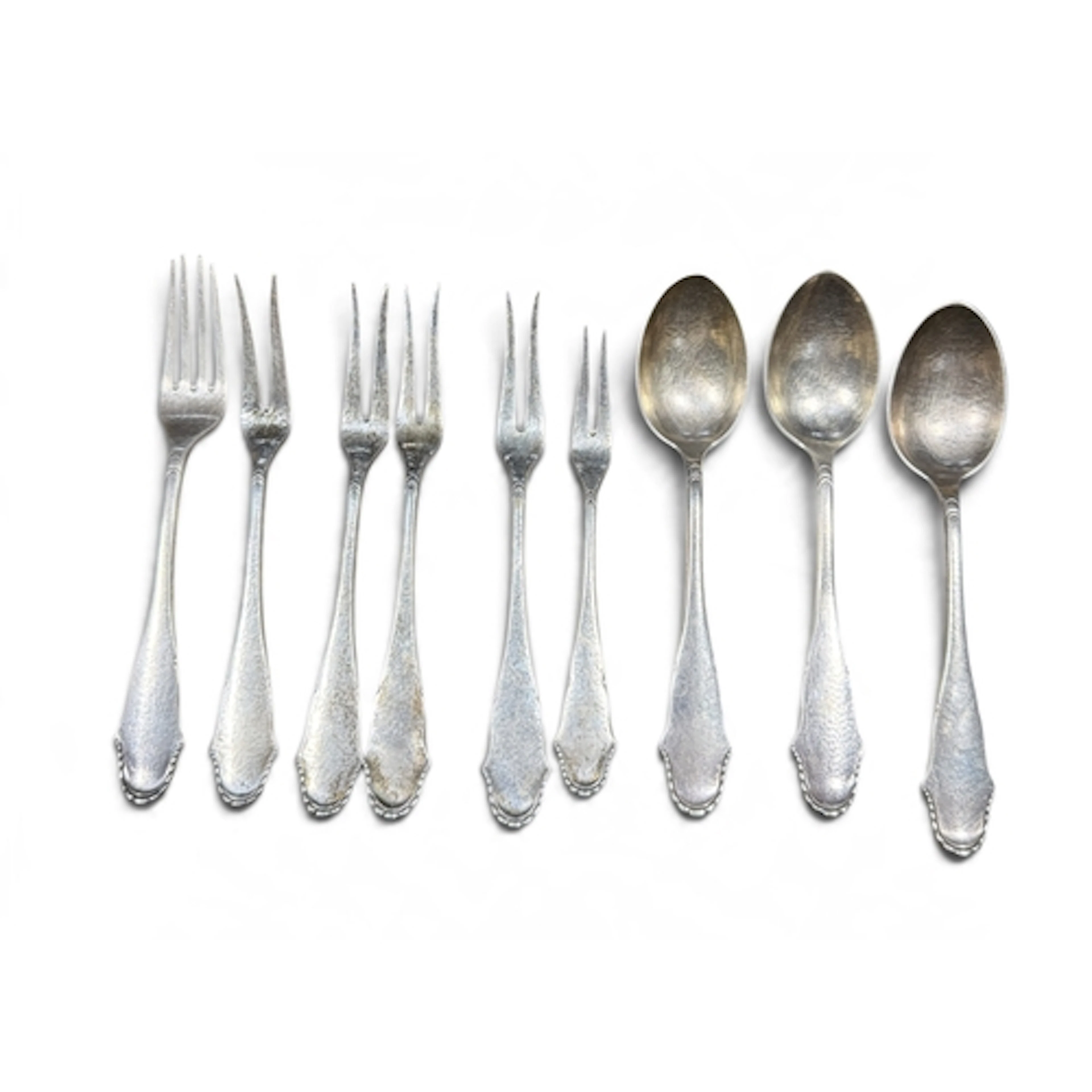 THREE DANISH SILVER SPOT-HAMMERED SPOONS AND SIX FORKS Bead ...