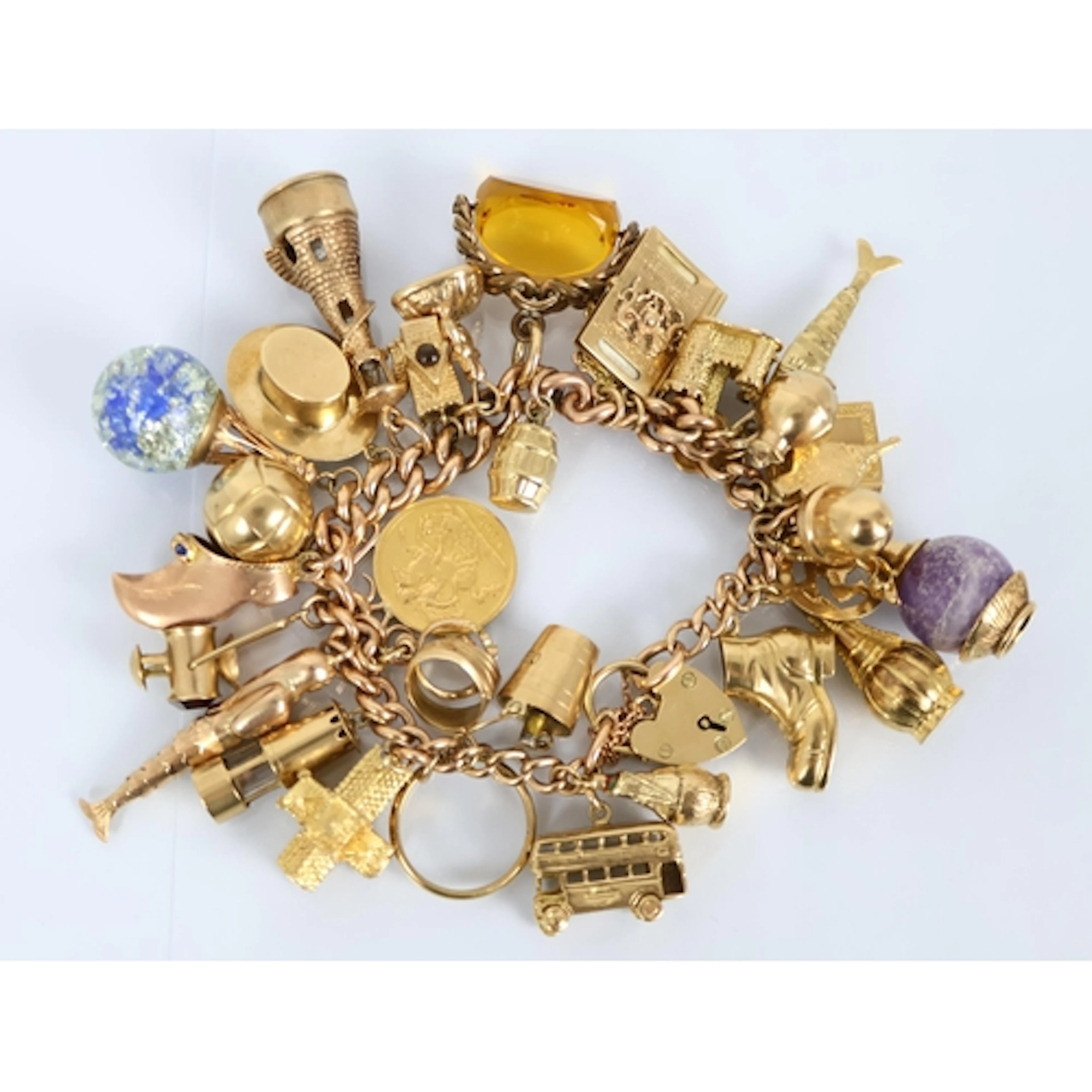 A 9ct yellow gold curb link bracelet with attached padlock c...