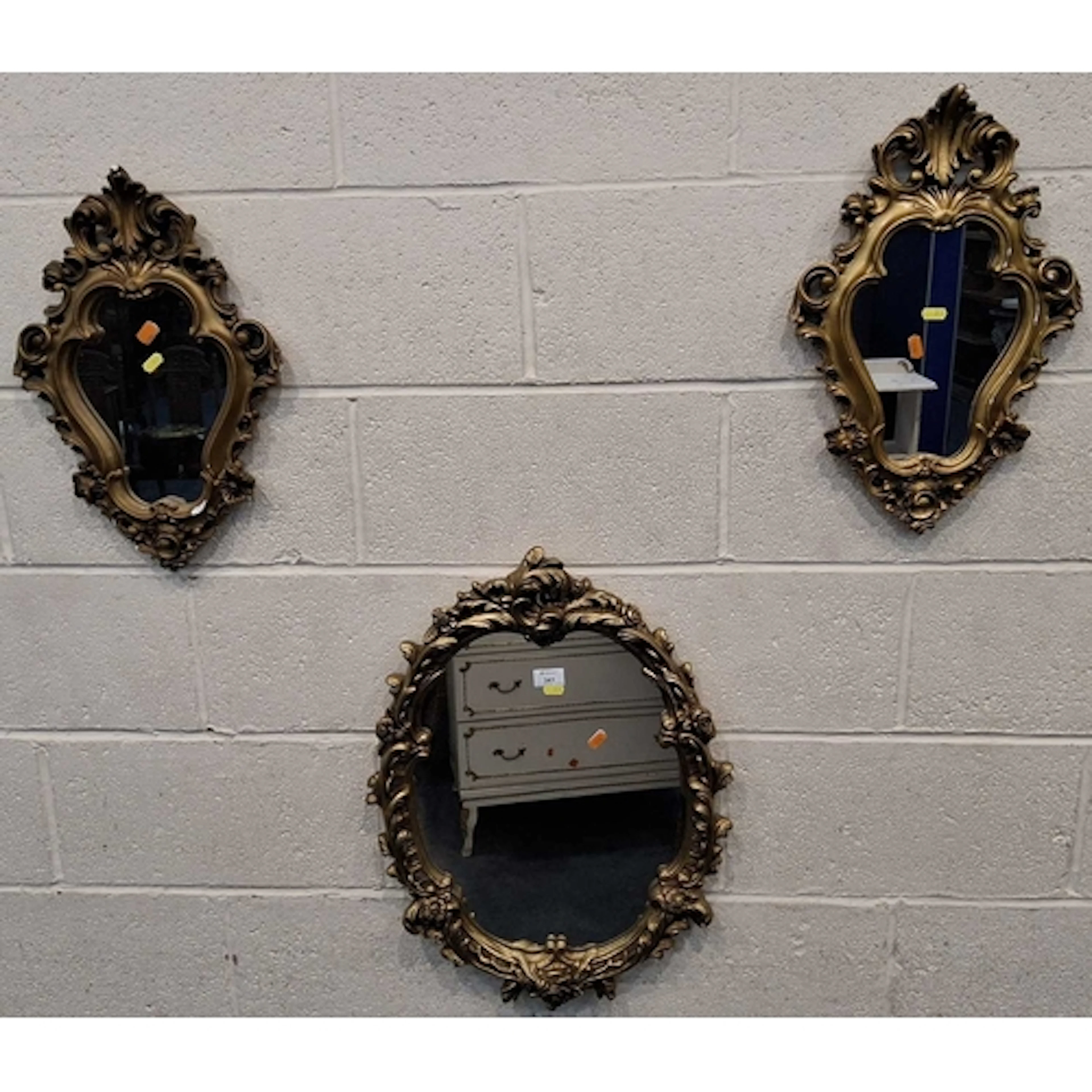 THREE GILT GESSO WALL MIRRORS, all with scrolled and foliate...