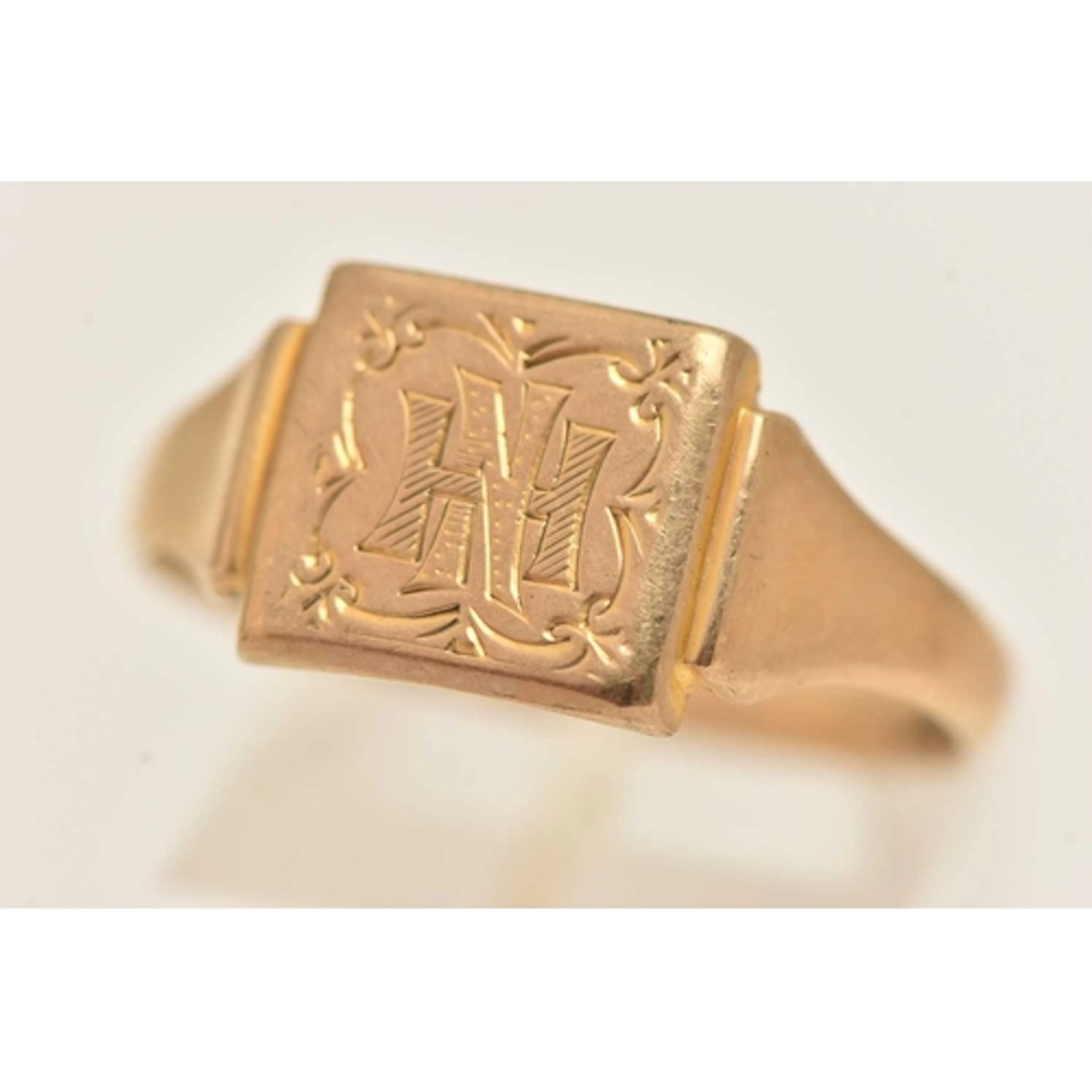 A 9CT GOLD SIGNET RING, square form signet with engraved ini...