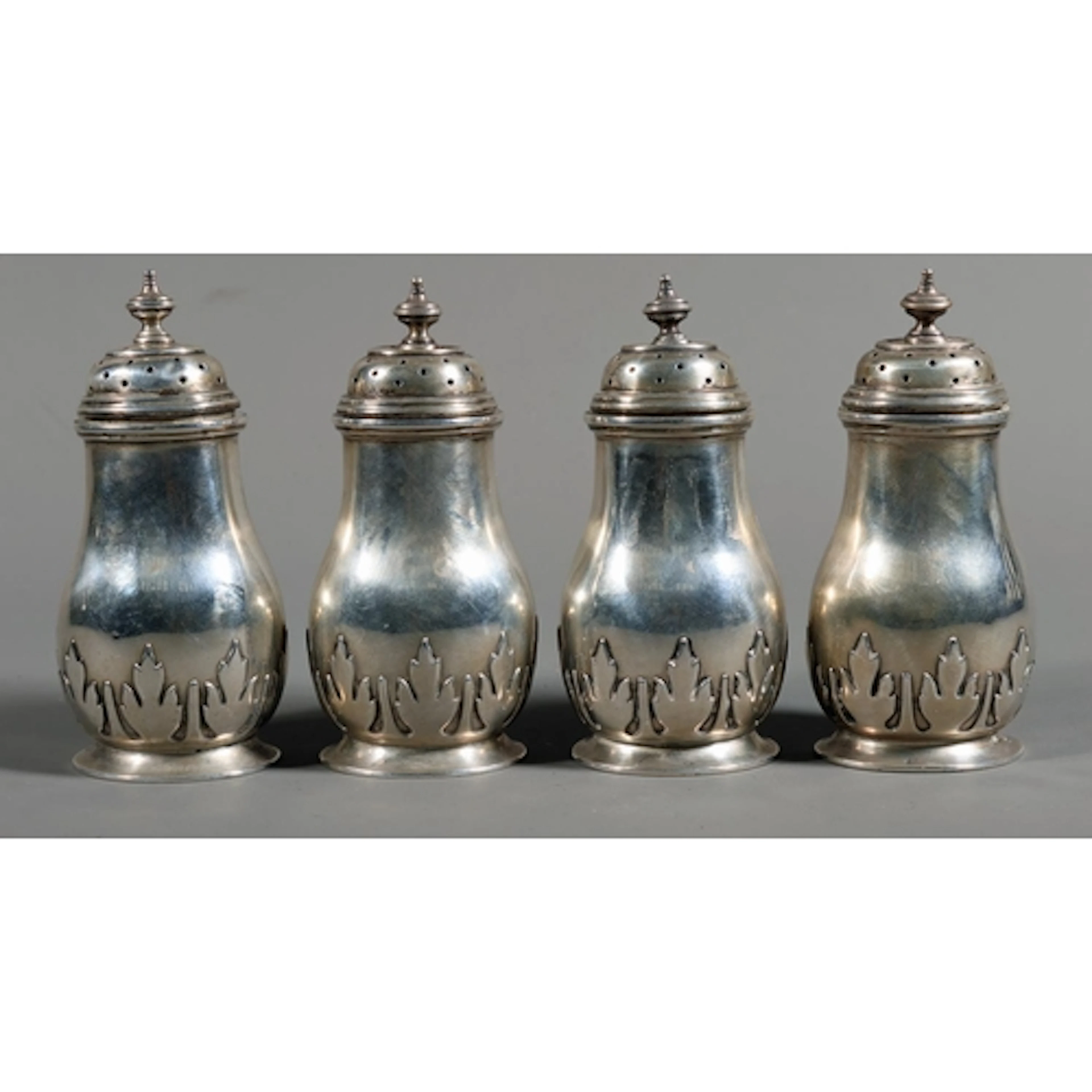 Set of four King George V silver pepper pots by R & S Ga...