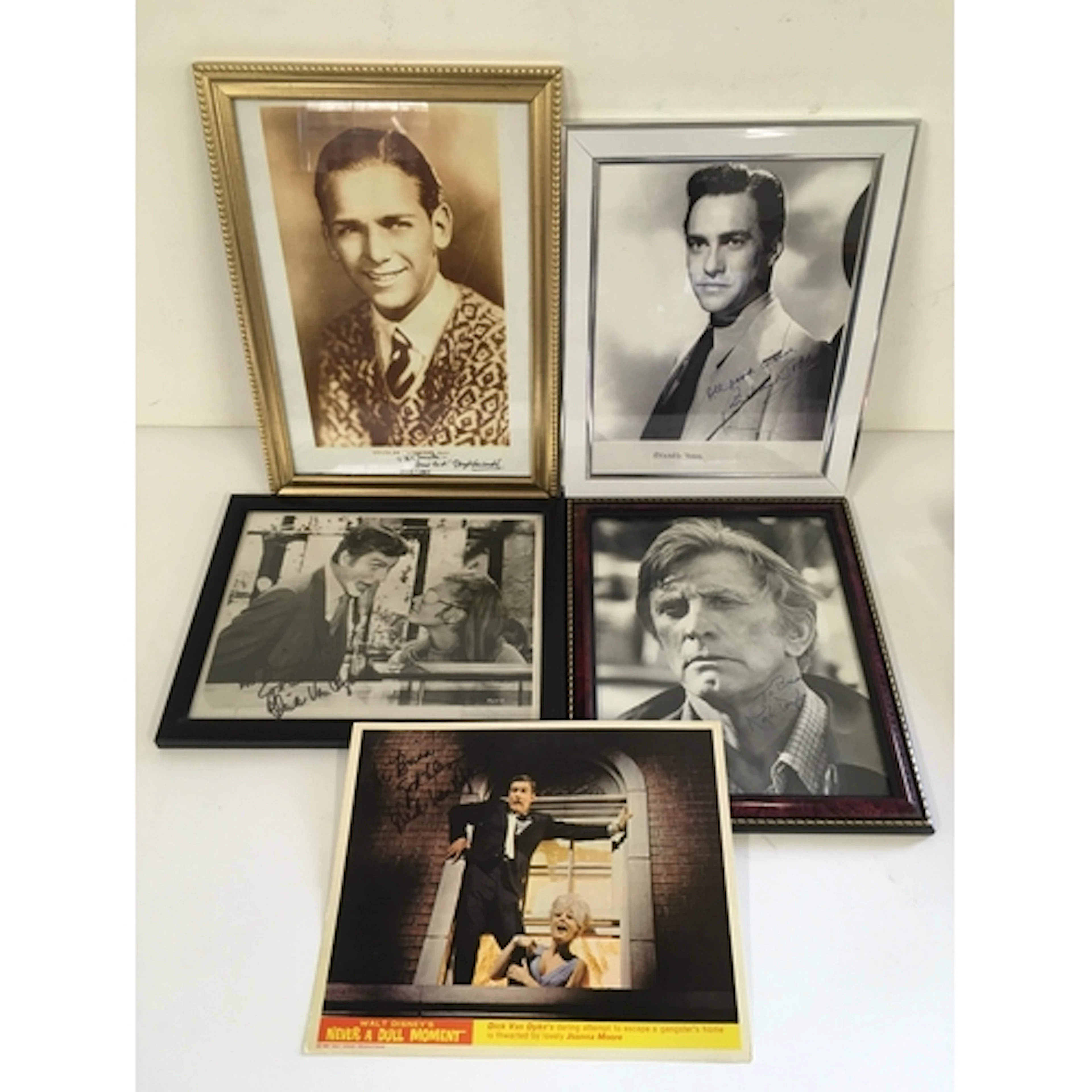 Four signed photos and a lobby card by Michael Douglas, Rich...