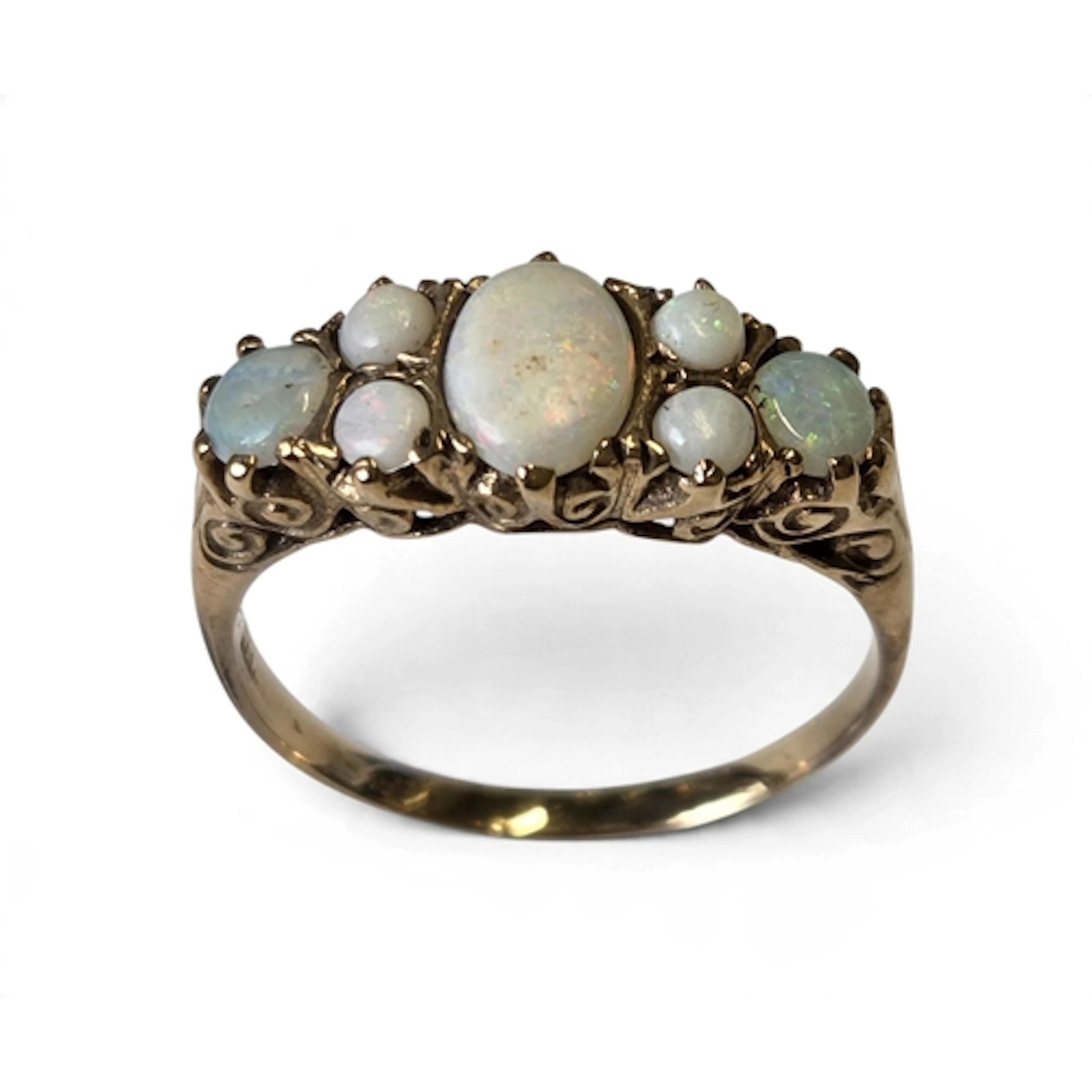A good antique 9-carat gold seven-stone opal ring, centred w...