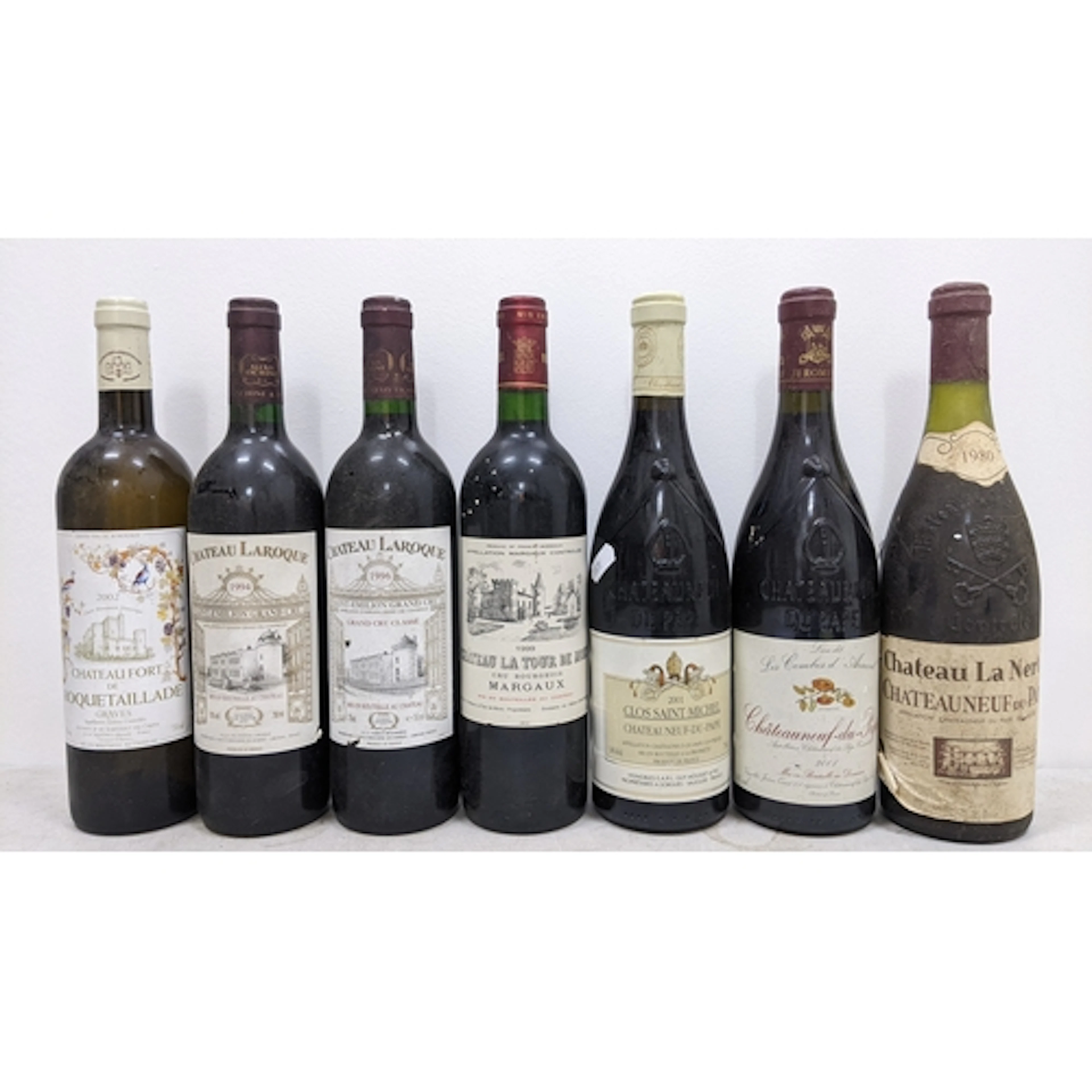 Seven bottles of French red wine, comprising:- - One bottle ...