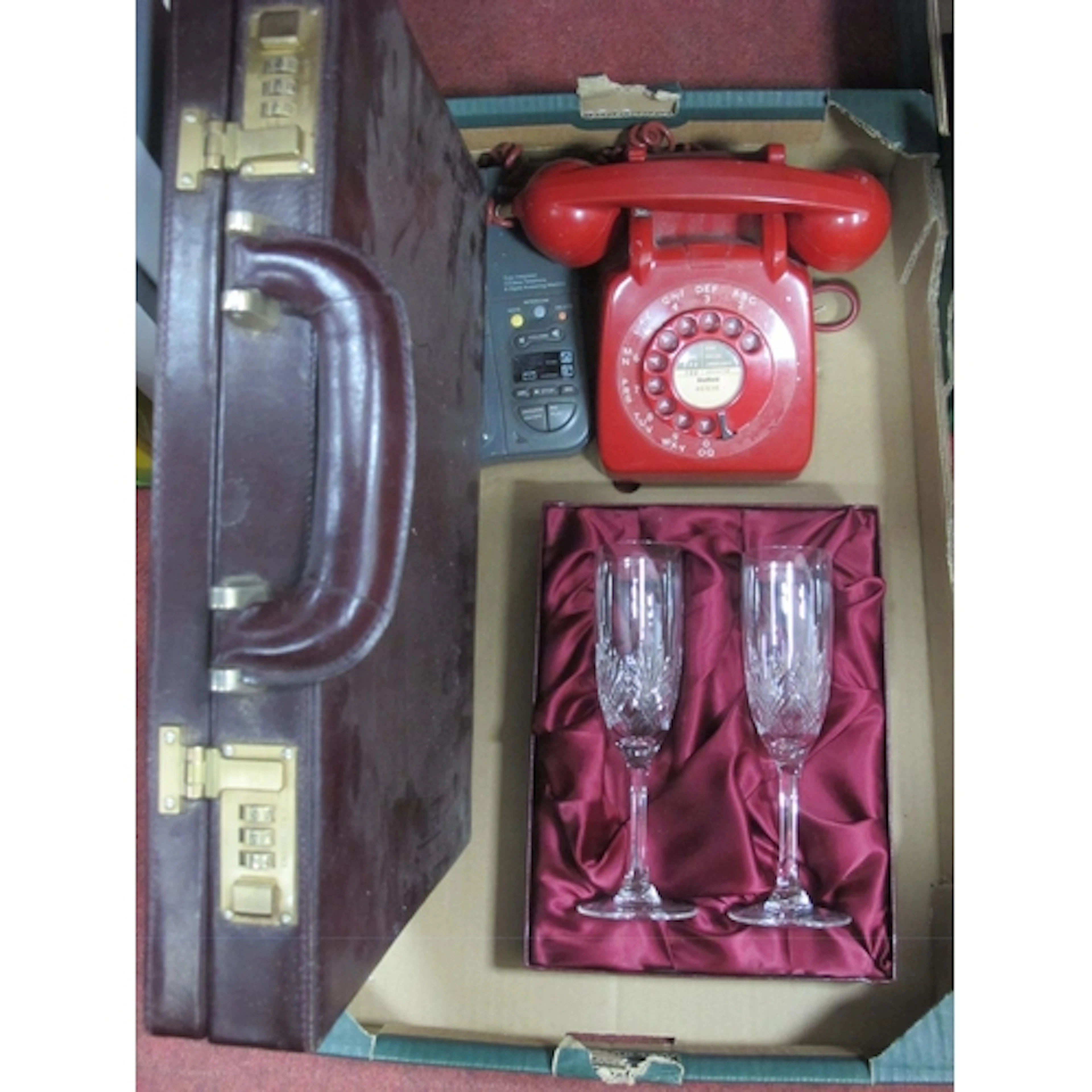 A Pair of Edinburgh Crystal Champagne Flutes, Red anvil tele...