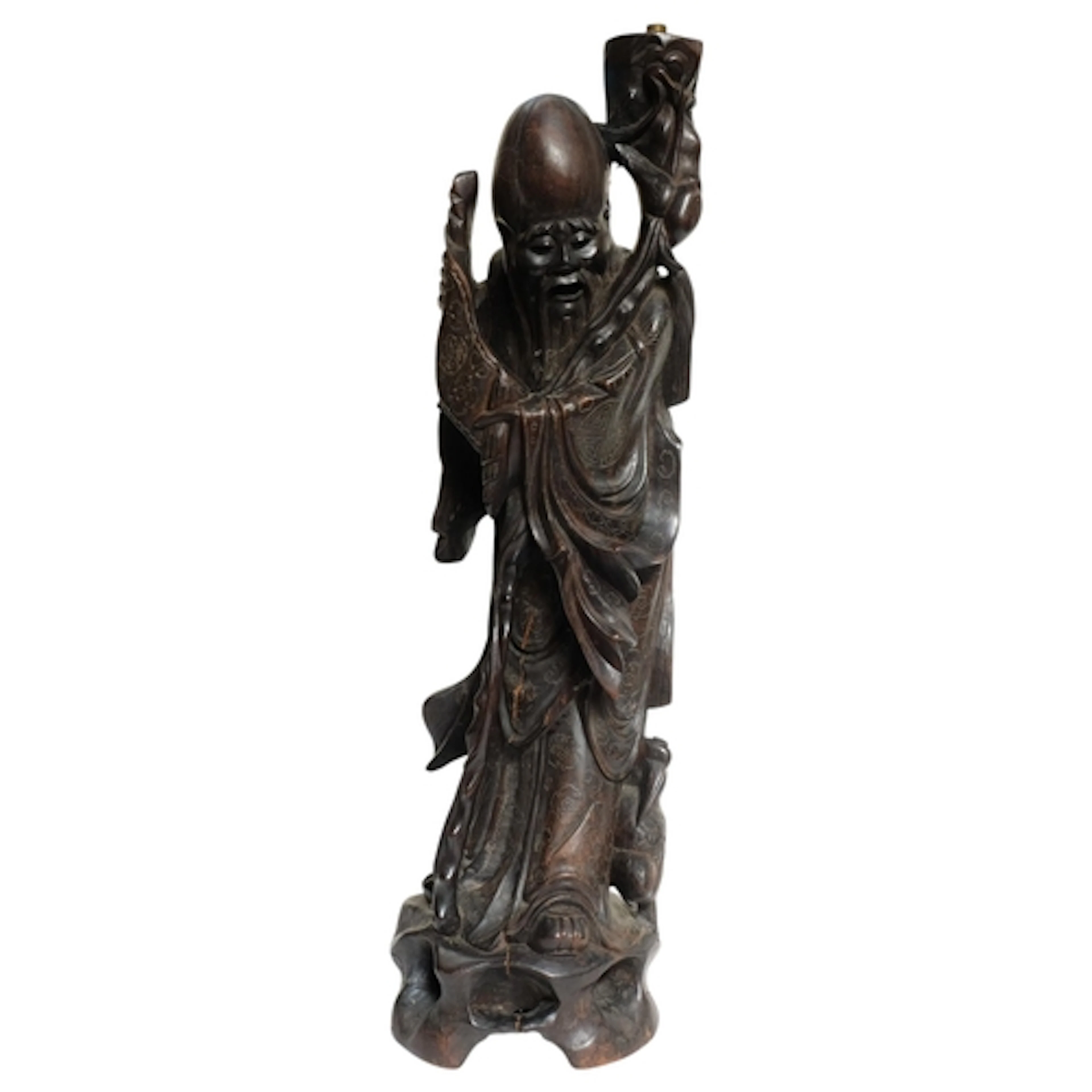 A large carved and ebonised wood Oriental sage figure, conve...