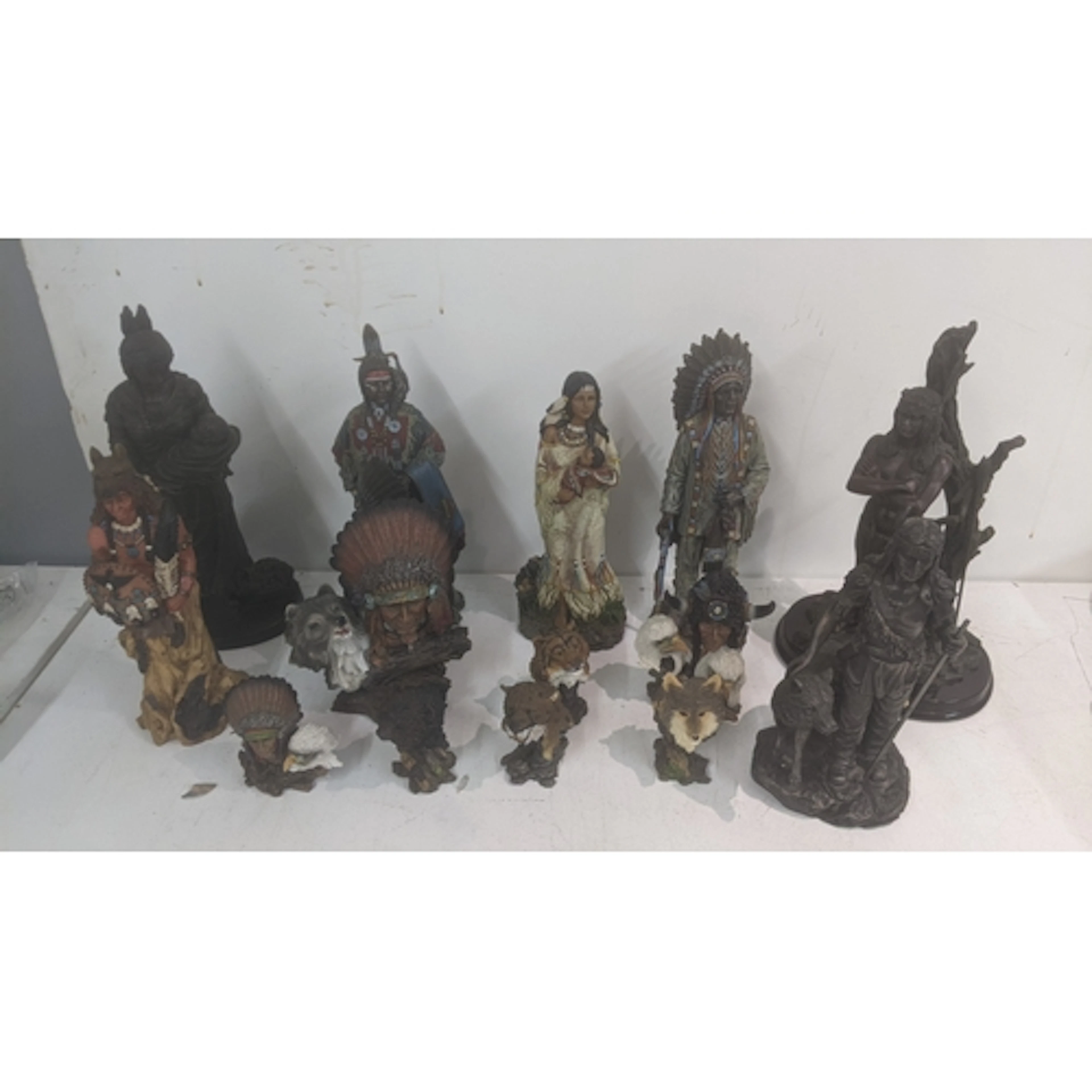 A group of Native American related figurines to include a Sh...