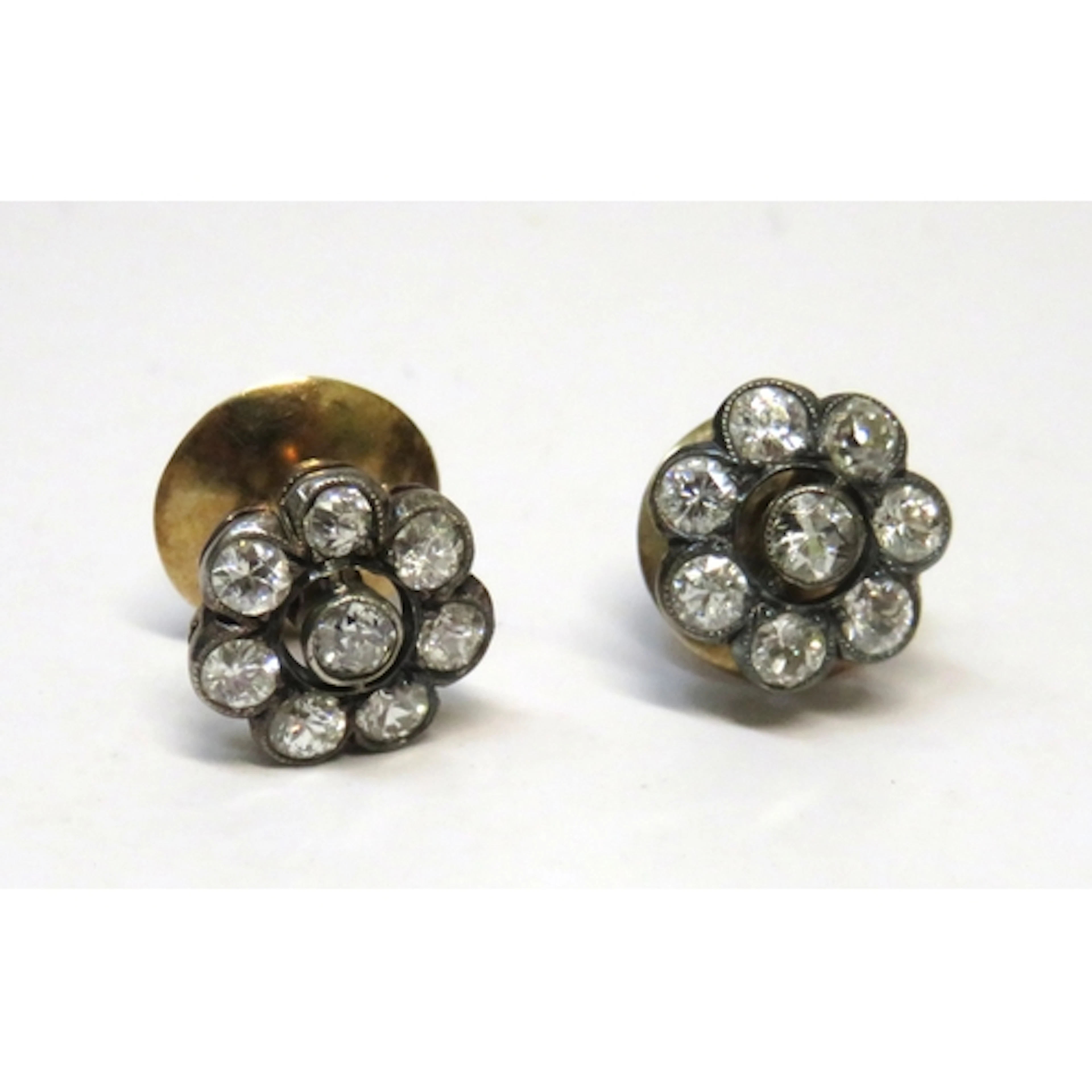 Pair of antique gold and old cut diamond set flower head clu...
