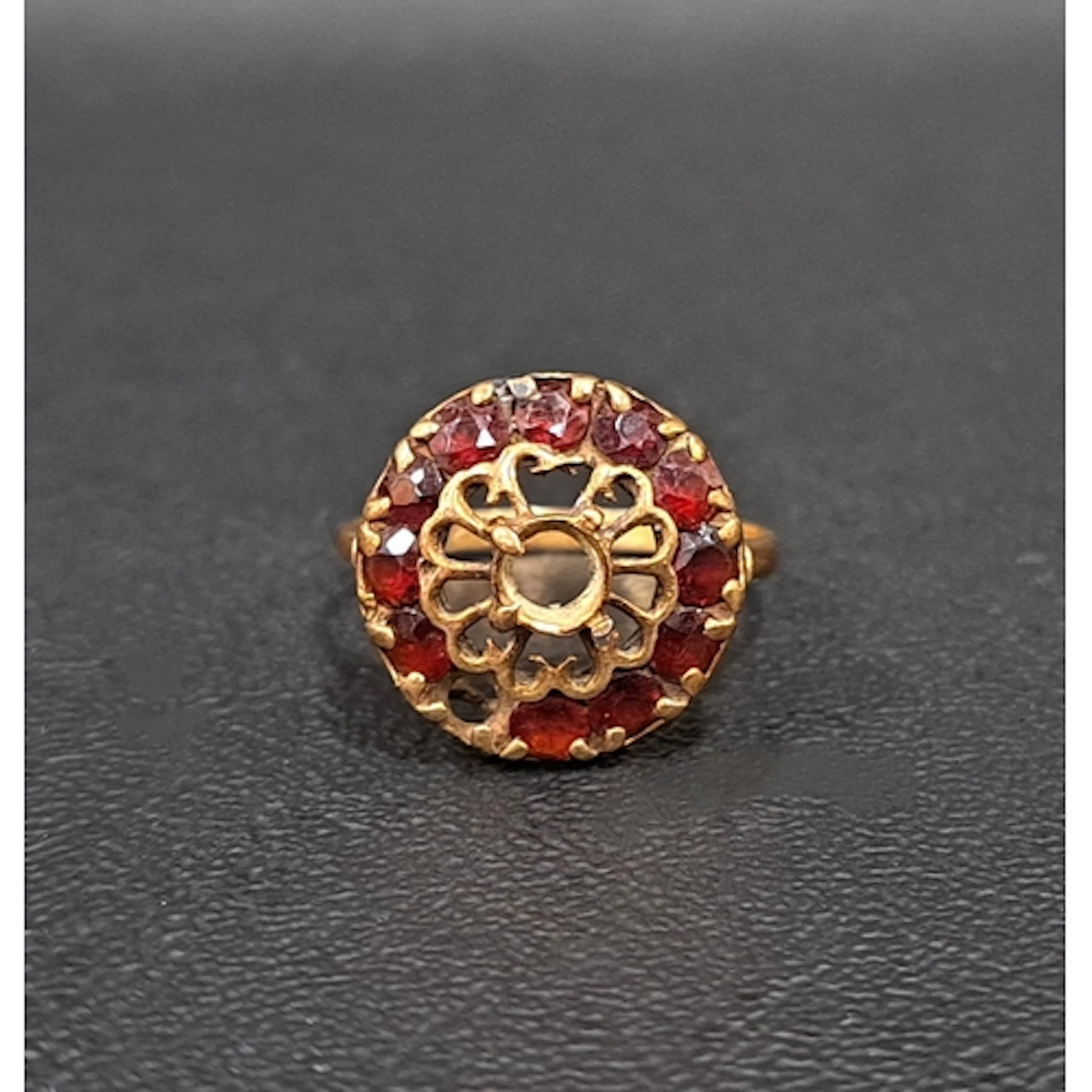 GARNET CLUSTER RING on nine carat gold shank, ring size P an...