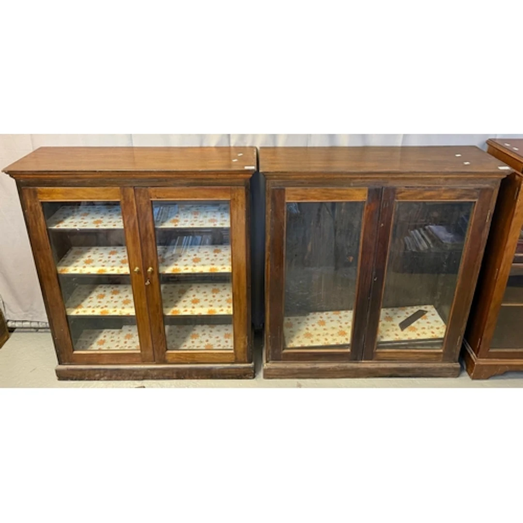 Near pair of mahogany pier cabinets each with two glazed doo...