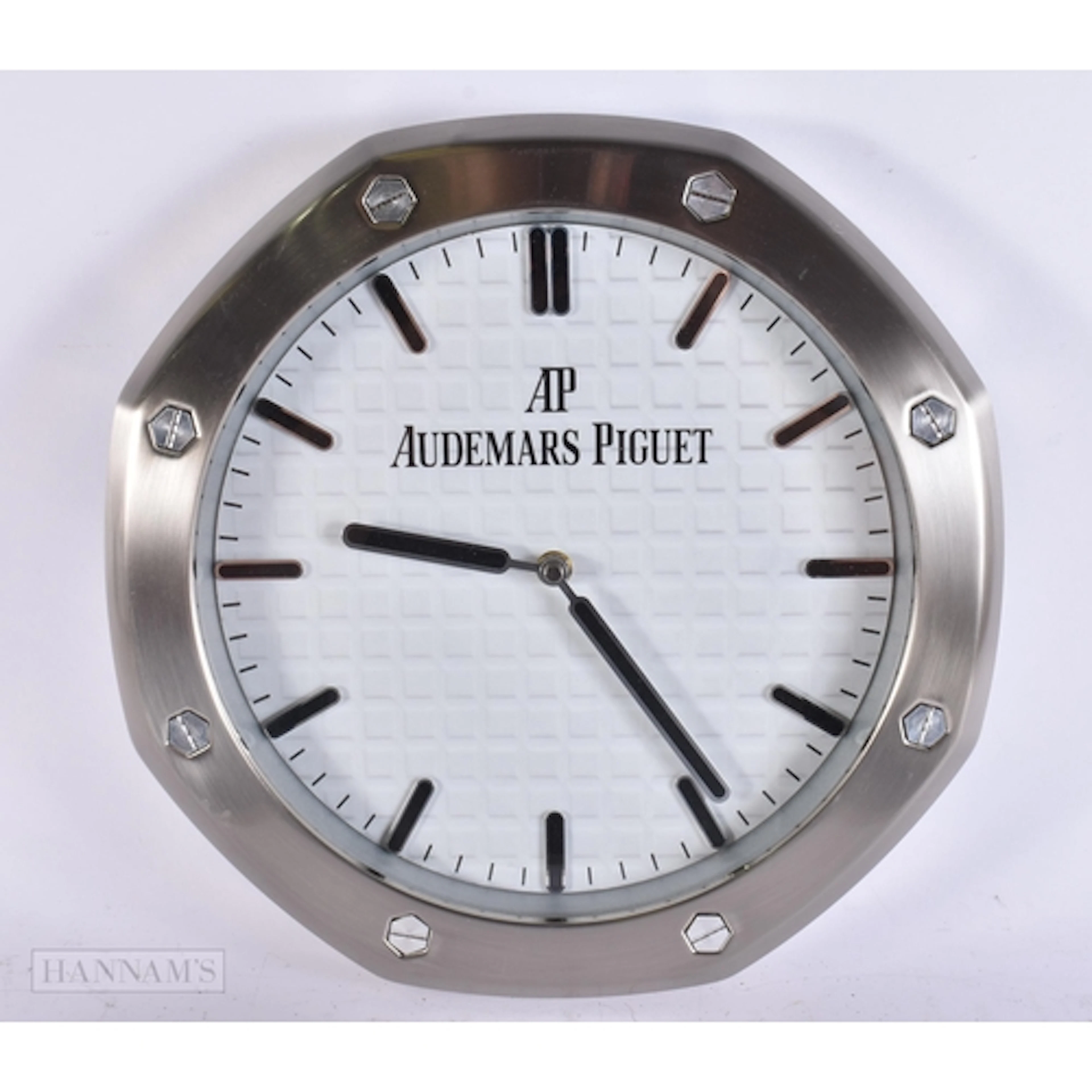 AN AUDEMARS PIGUET WALL CLOCK. 34 cm wide.