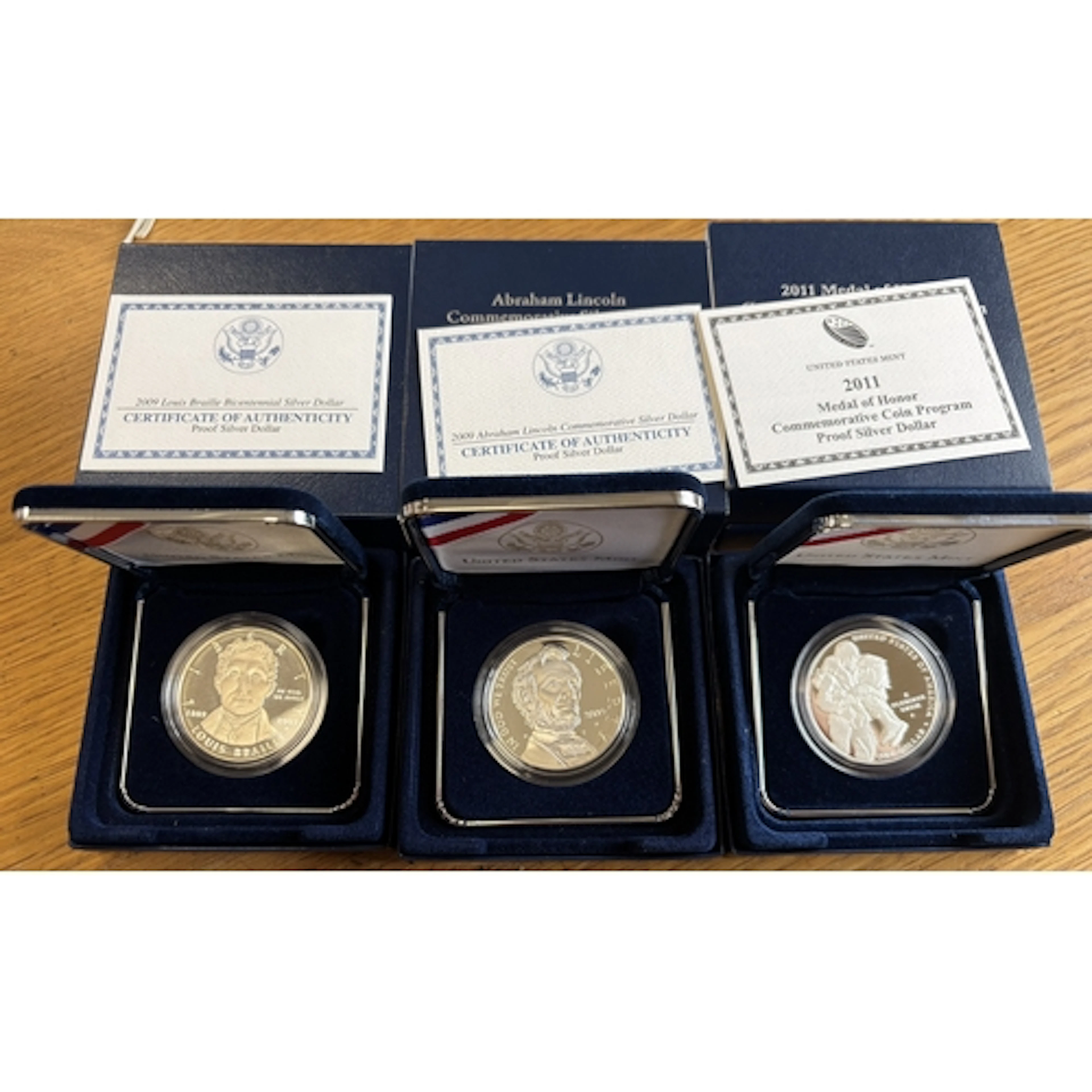 USA. Collection of silver boxed proof FDC, including $1 2002...