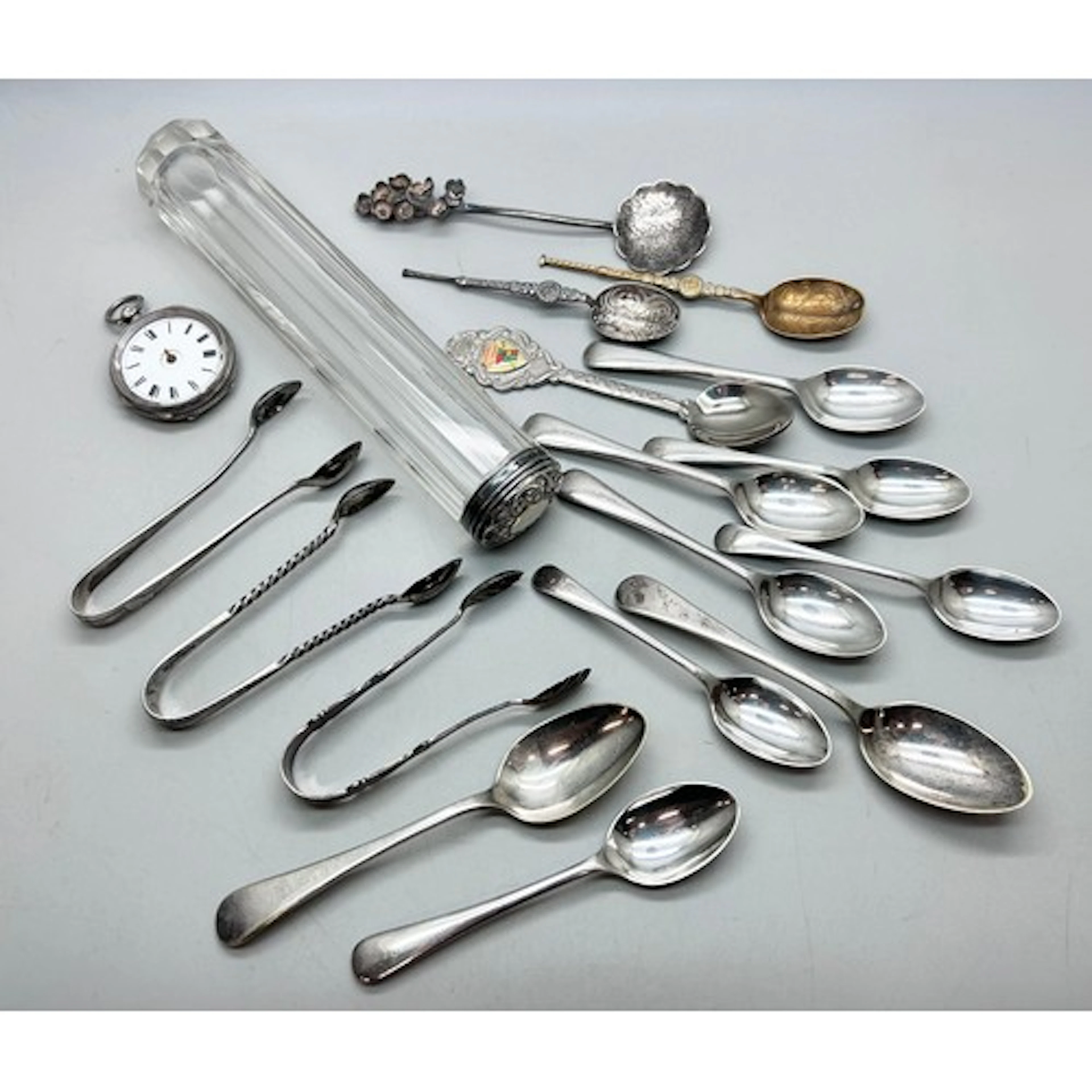 Two pairs of silver sugar tongs, two silver spoons, 59g tota...