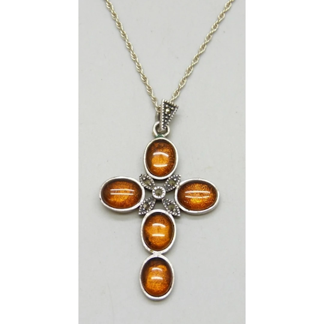 A silver cross pendant, 4.8cm including bail, on a silver ch...