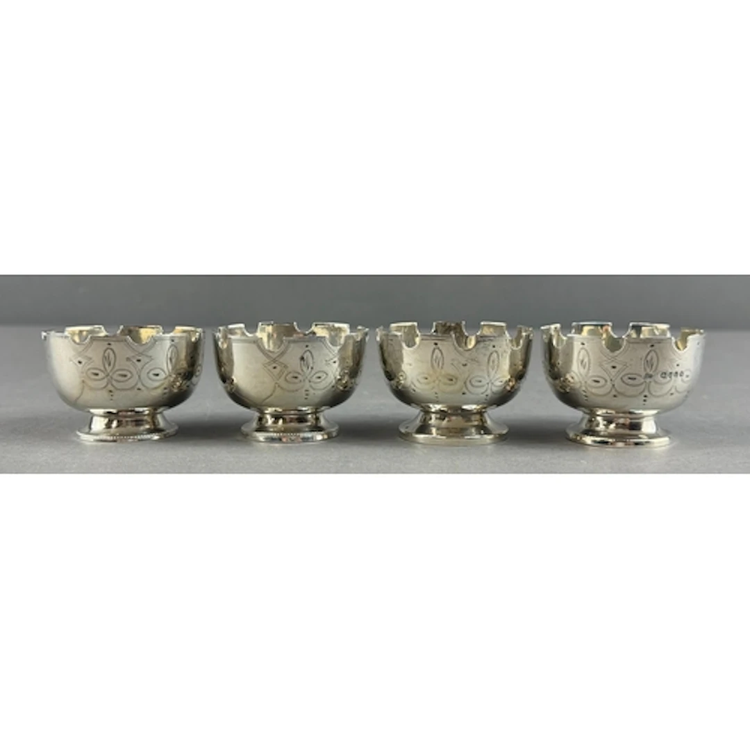 Silver: a set of four round castellated salts by Thomas Smil...