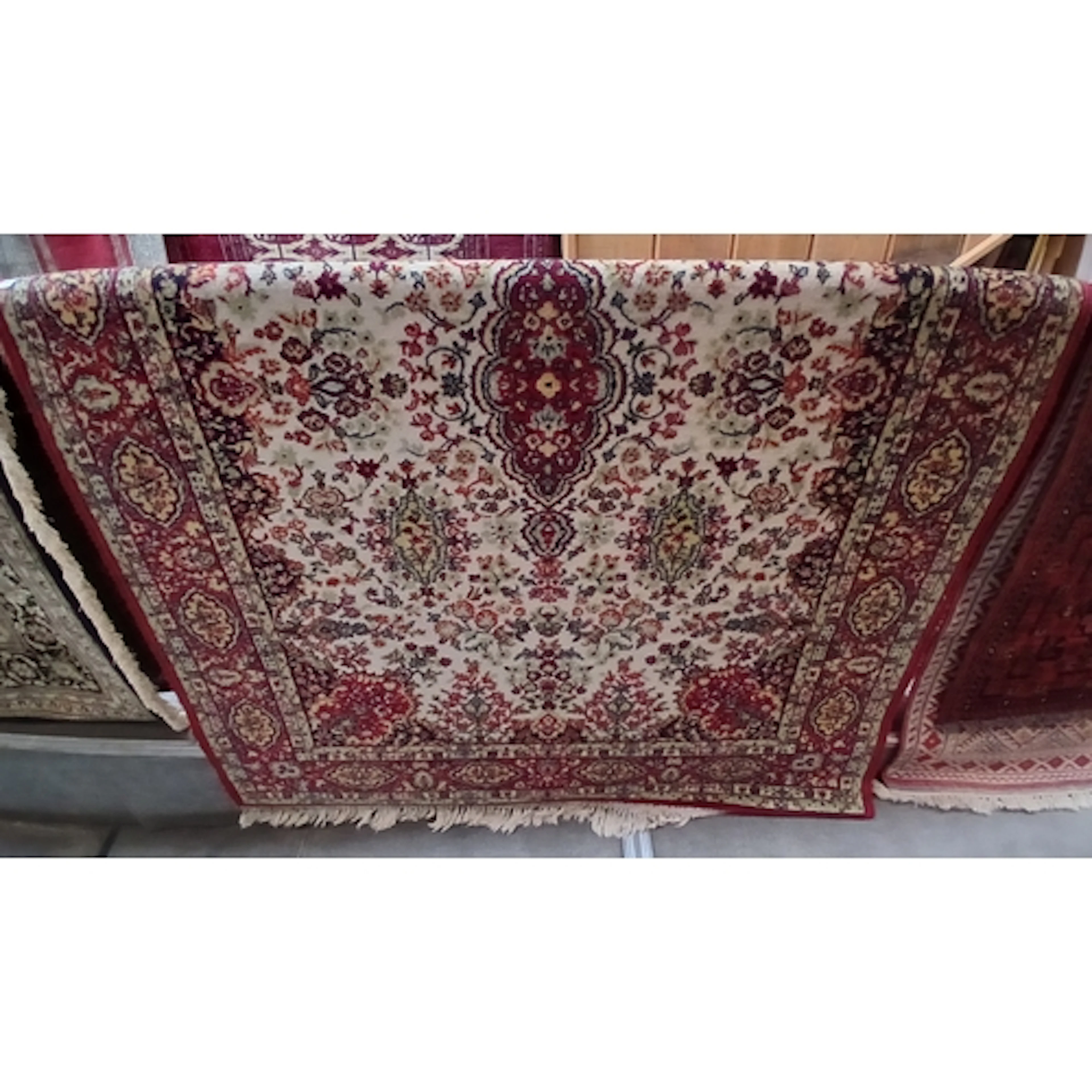 An eastern carpet 196cm x 142cm.